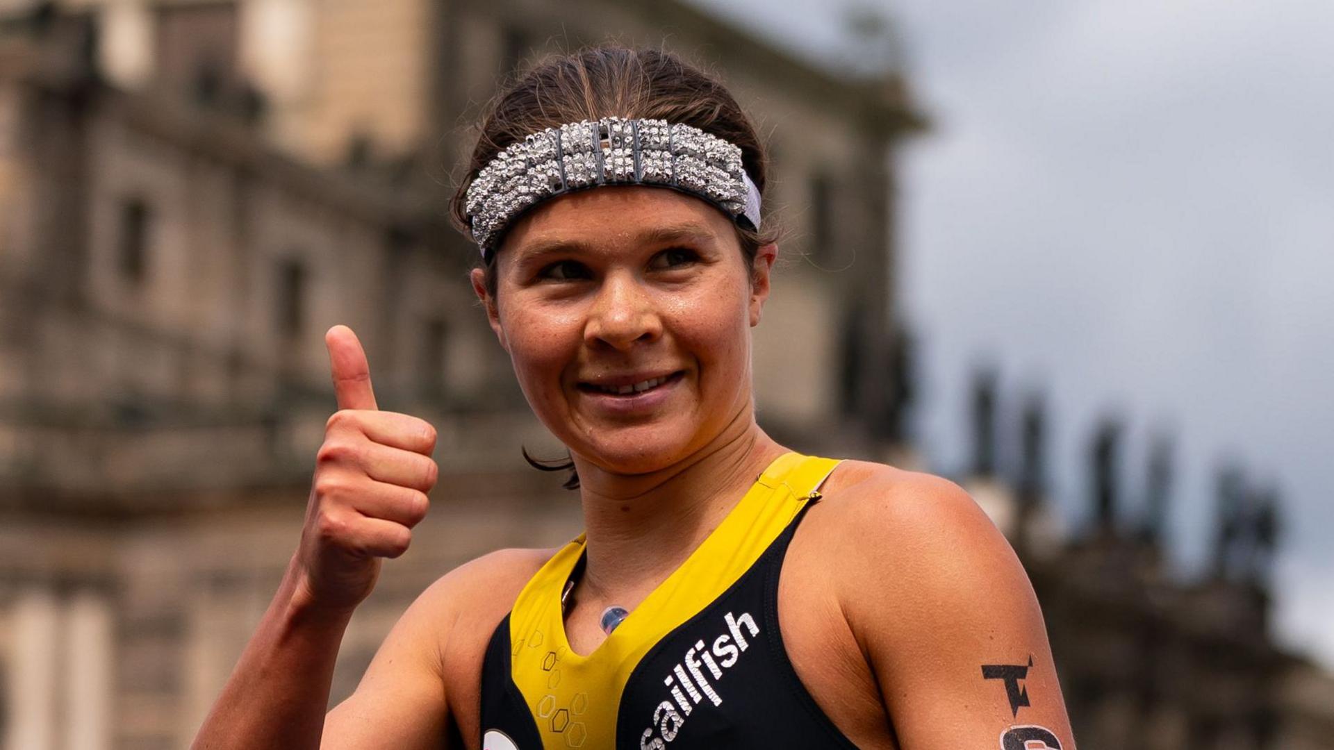 Lisa Tertsch gives the thumbs up after a triathlon