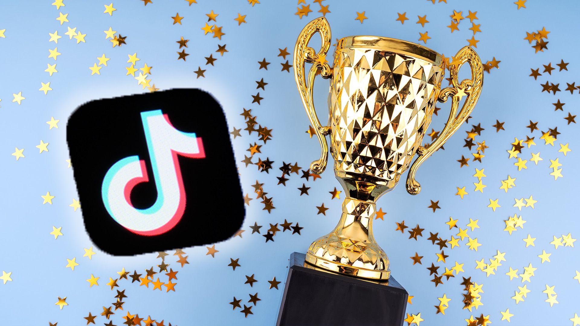 TikTok app logo with a trophy and confetti on the light blue background