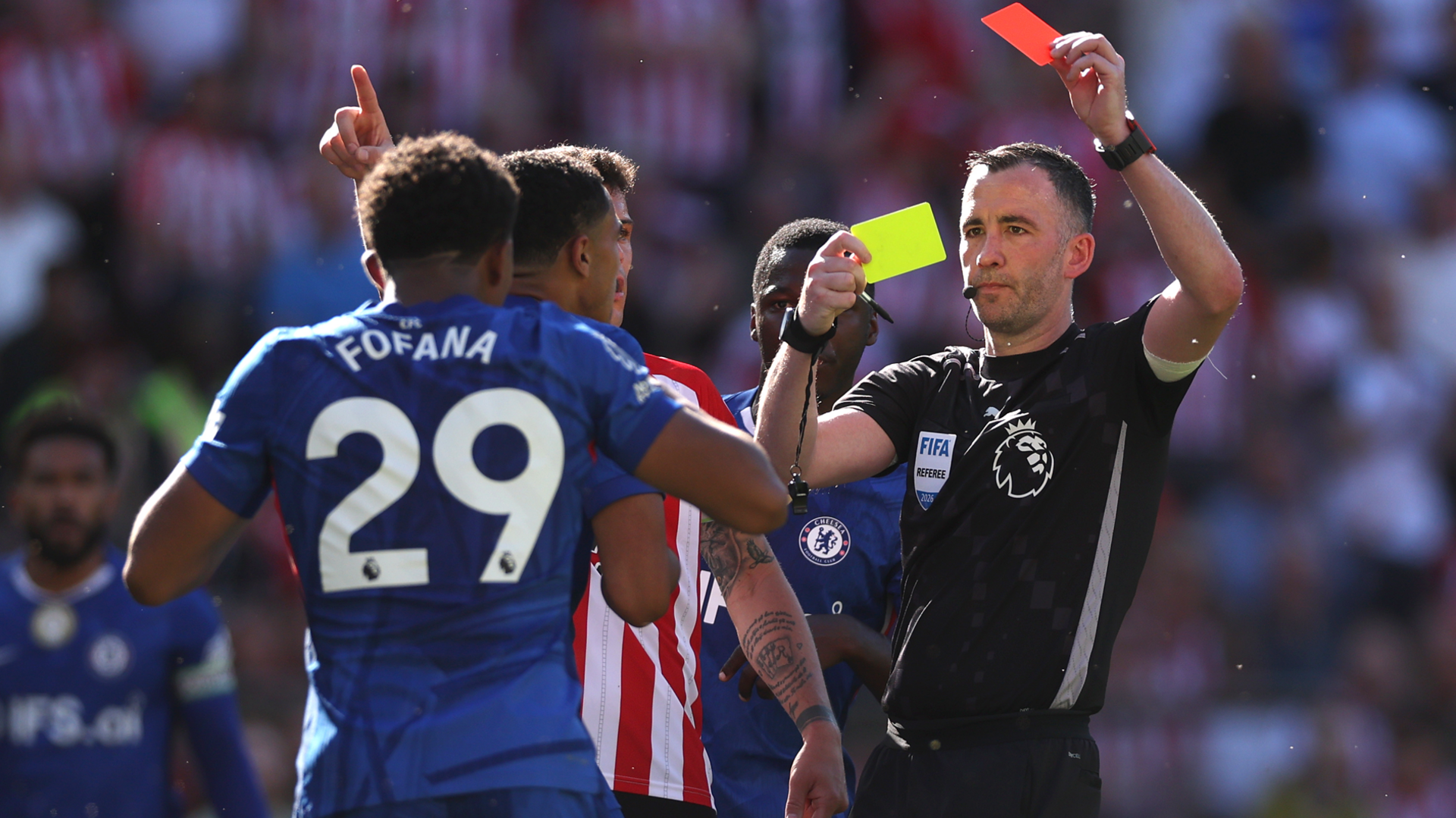 Referee Chris Kavanagh shows Wesley Fofana of Chelsea a second yellow card resulting in a red card