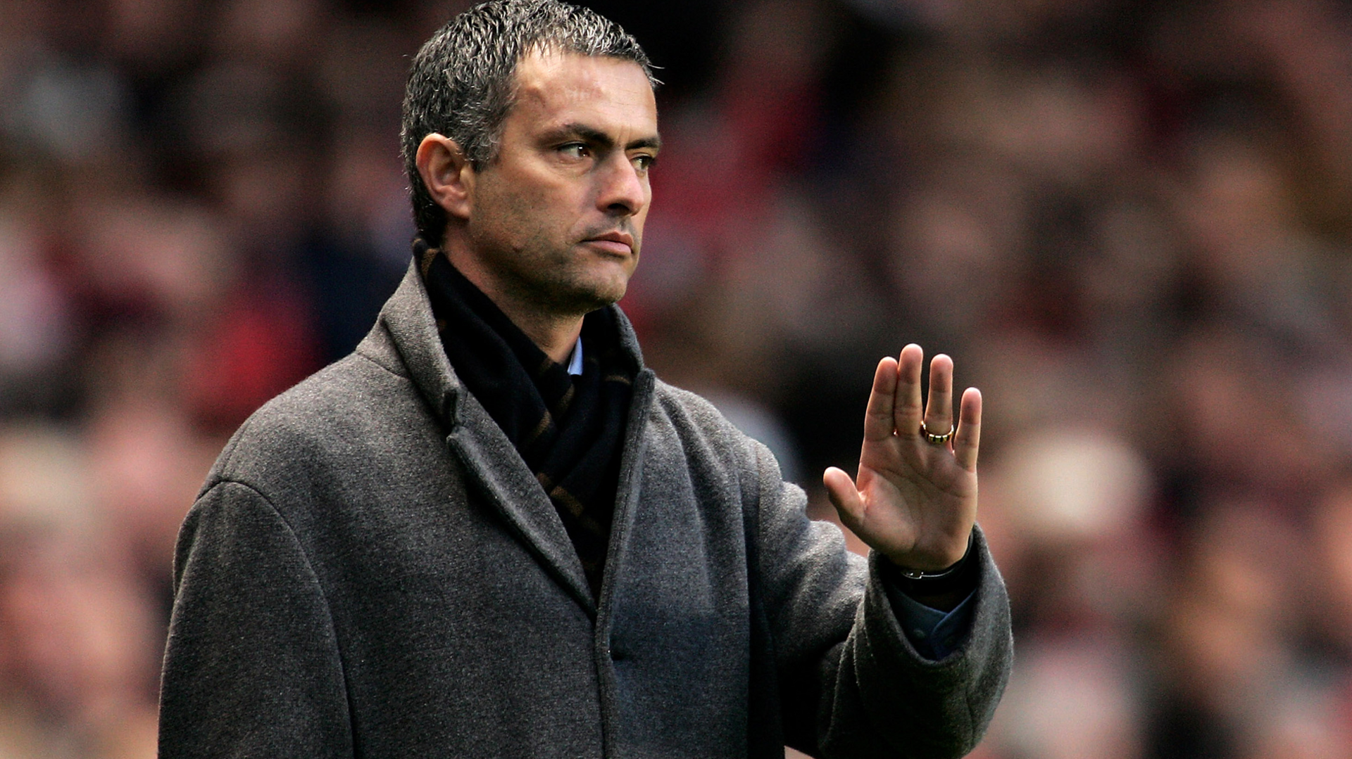 Jose Mourinho holds his hand up