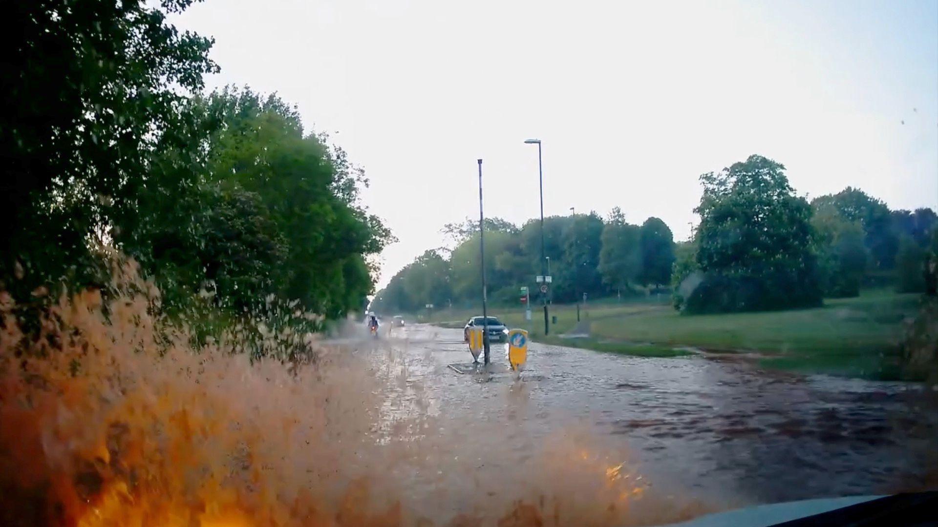 A flooded street in Derby after a burst pipe