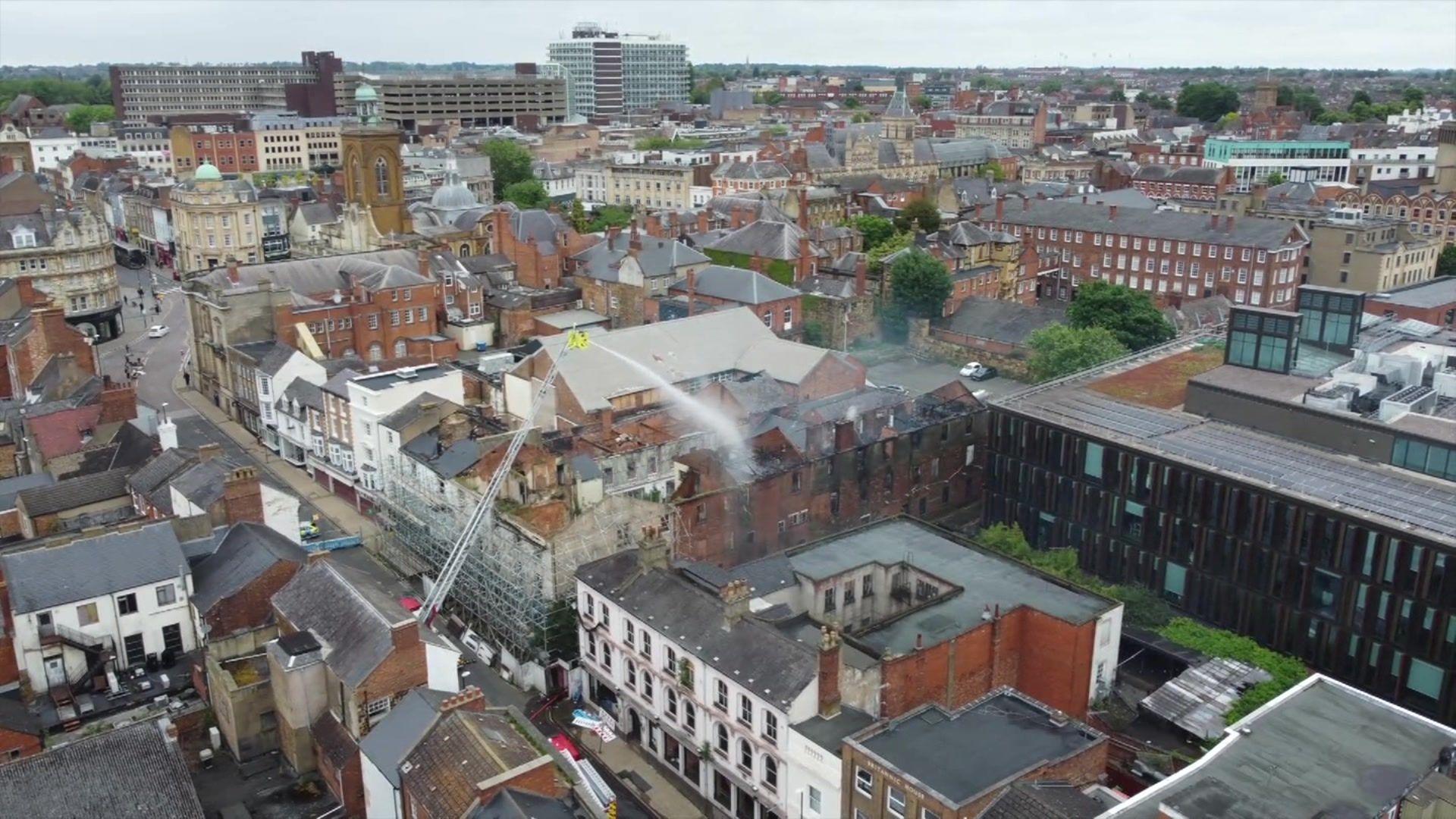 Aerial view of water being poured over a building