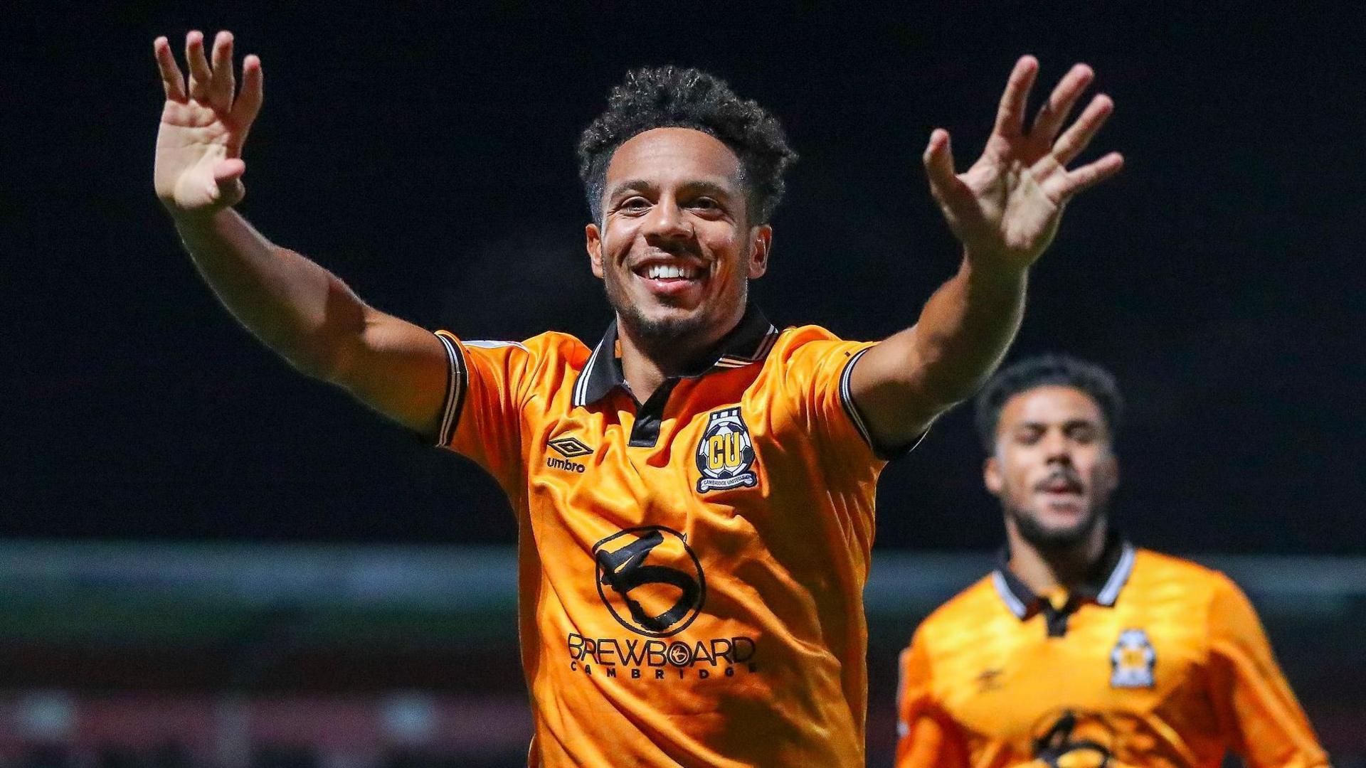 Cambridge United midfielder Korey Smith celebrates his first goal for the club after scoring against Stevenage