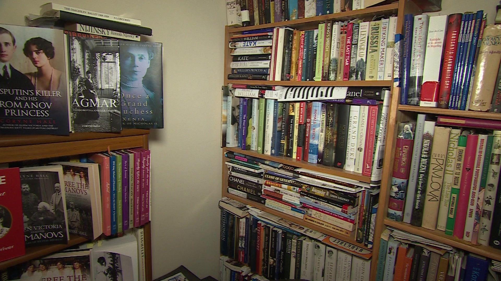 A room filled with bookshelves stuffed with books.