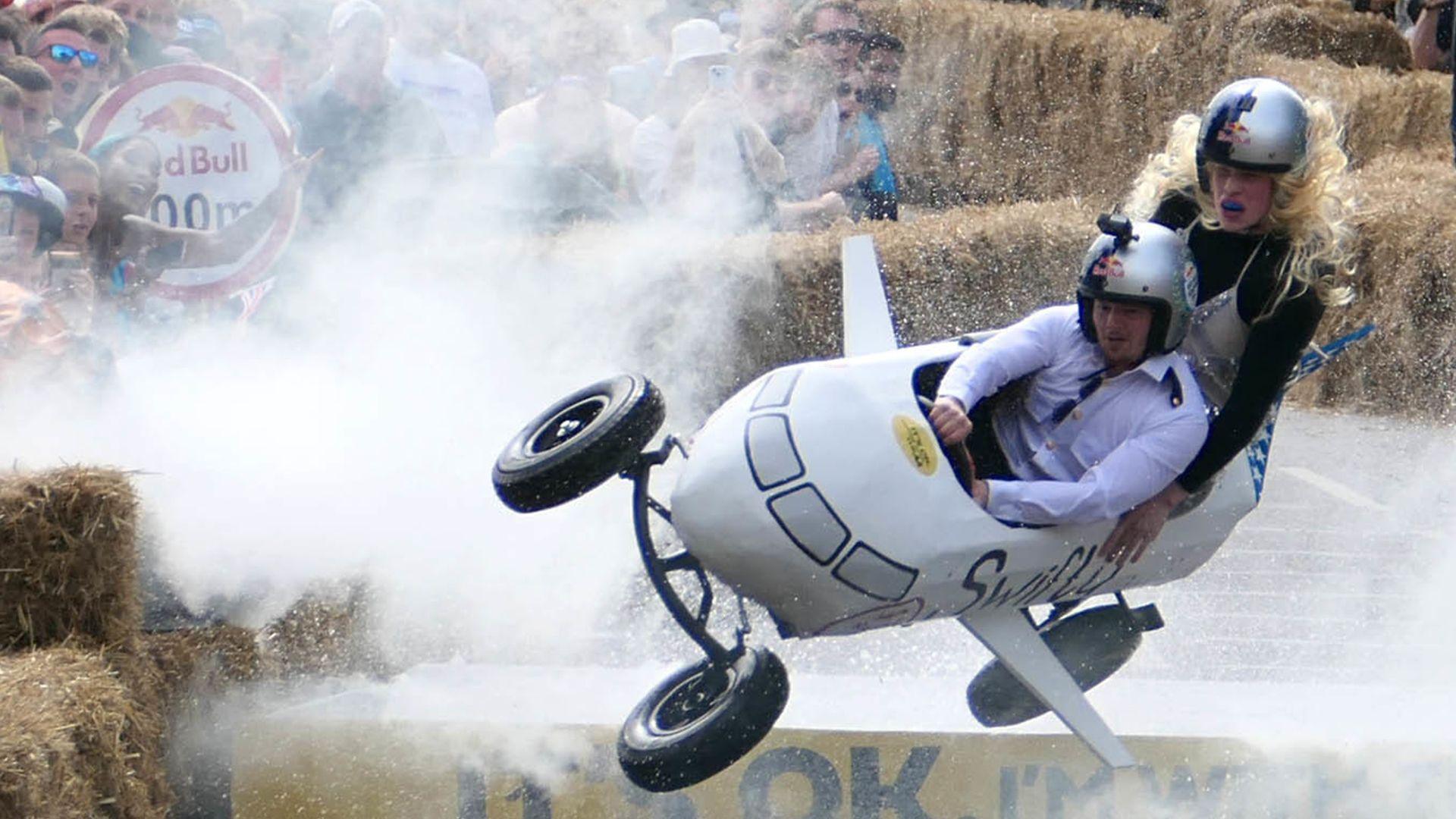 A homemade cart in the shape of an aeroplane flies through the air at the Red Bull Soapbox Races