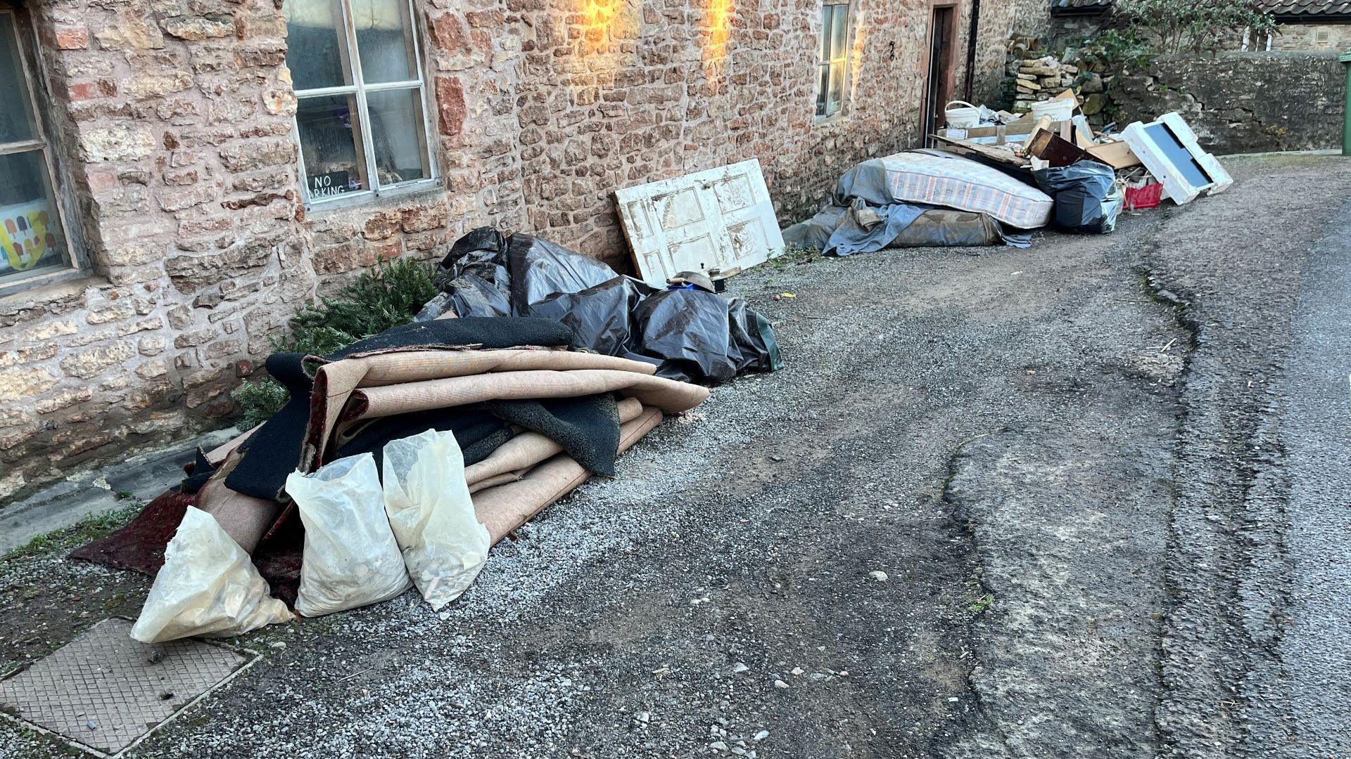 Houshold items left outside houses following floods