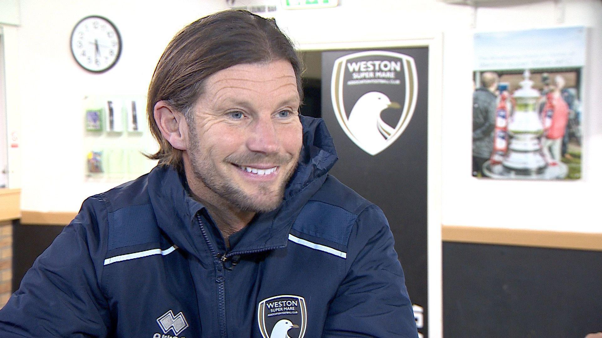 Scott Rogers sitting in the club house