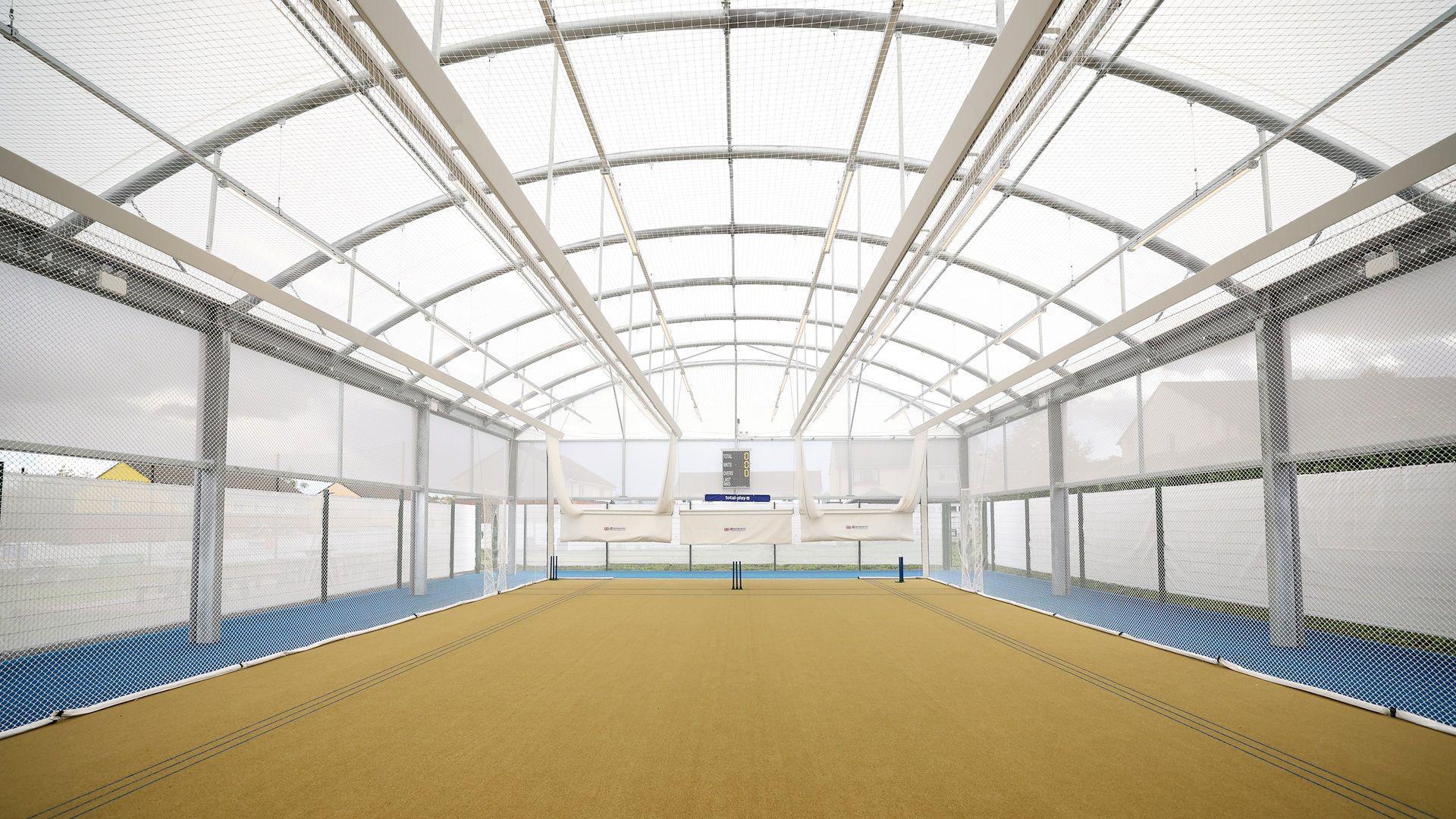 A wide view of a open space called the dome which is used to practice cricket