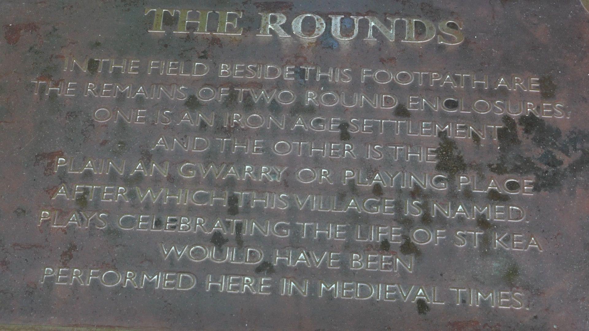 A slate engraved with historical information about the ancient remains in Playing Place