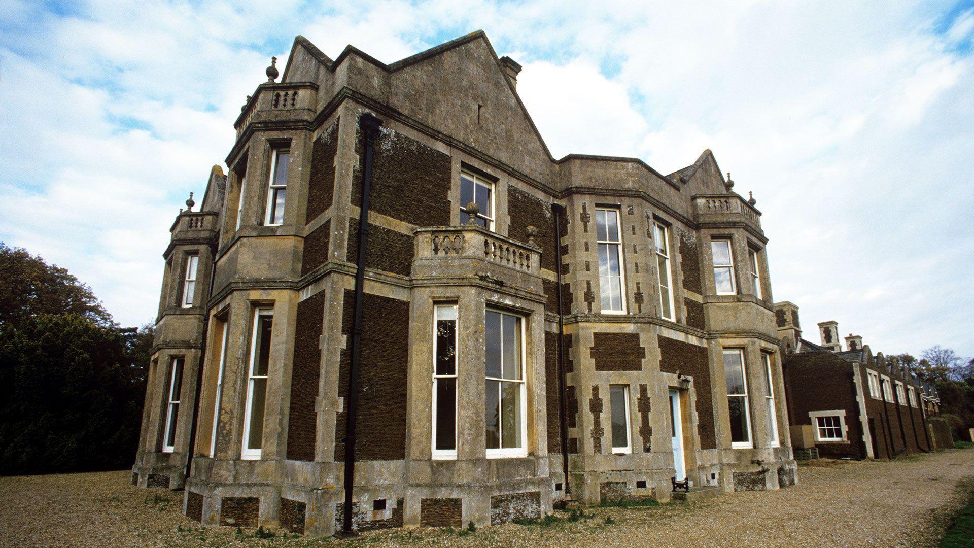 Park House - a brown, brick building with white window panes.