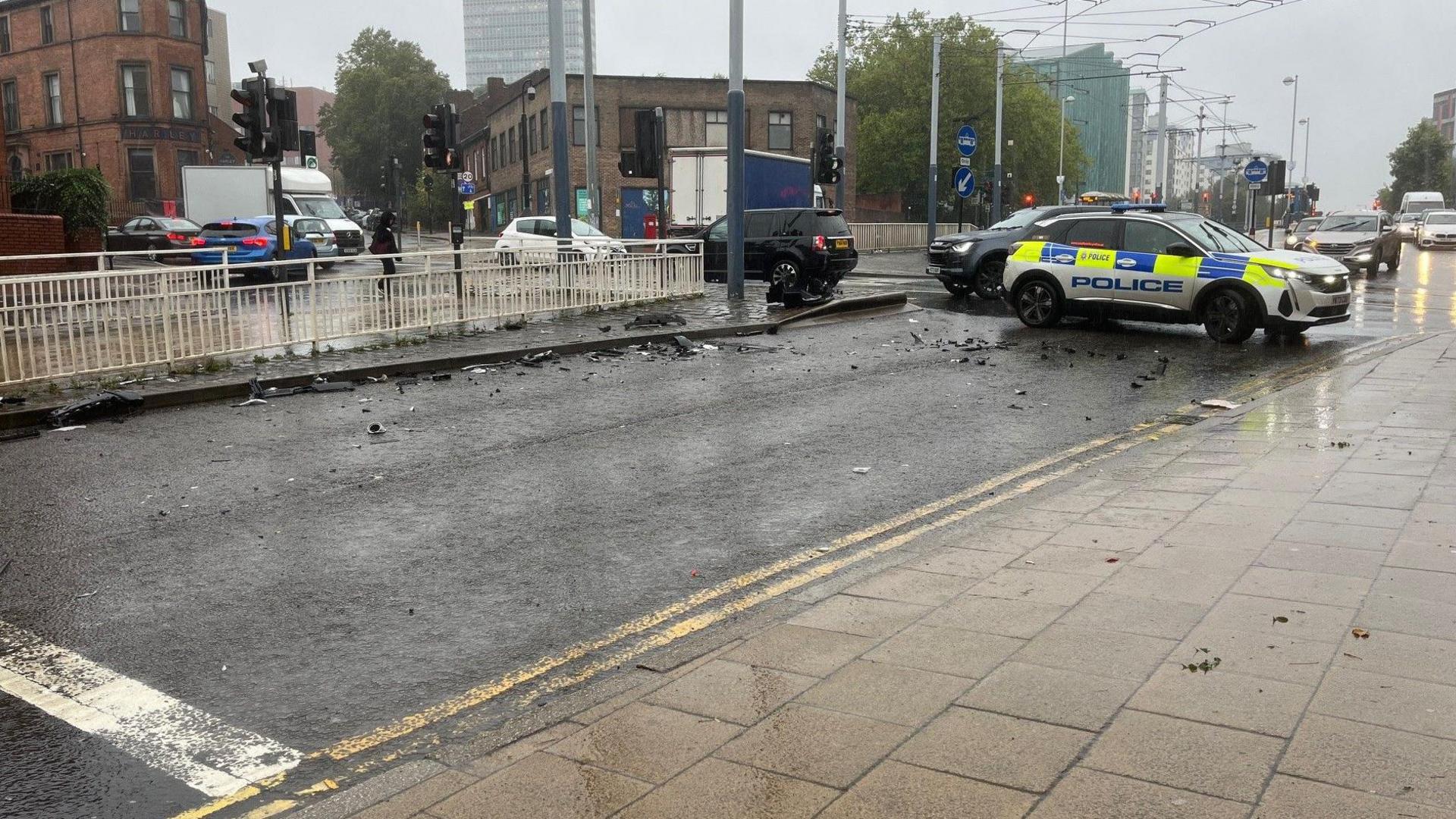 A police car blocks a road