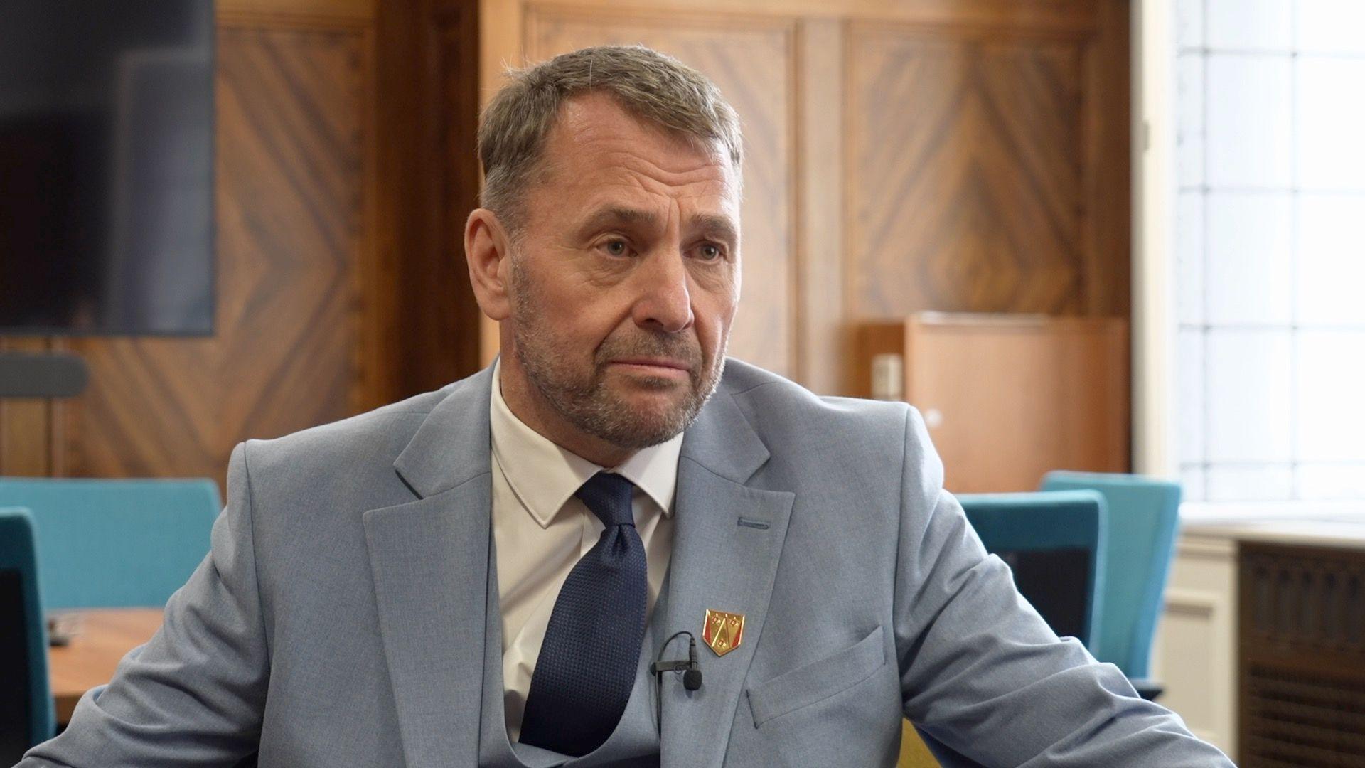 Stephen Atkinson, Reform council leader, dressed in a blue suit, with a waistcoat, and dark blue tie