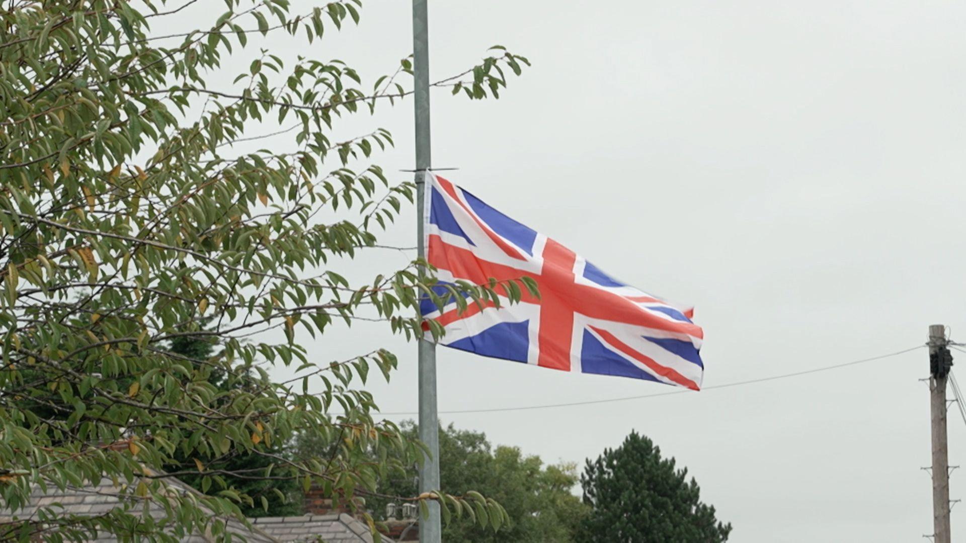 A Union Jack flag flies on Littleton Road in Salford, Greater Manchester, UK