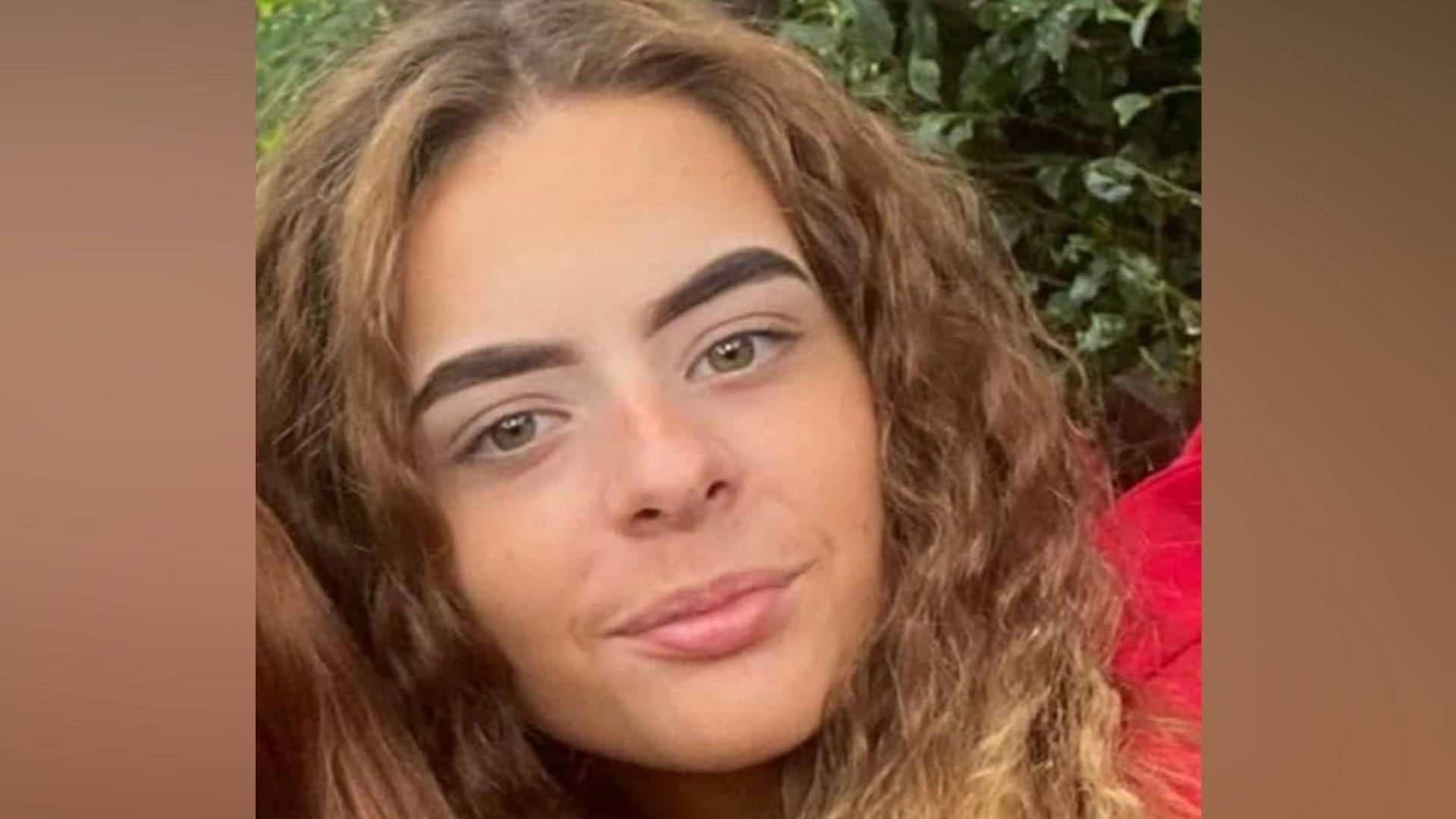 A close-up photograph shows Alisha Ponter with long hair looking towards the camera outdoors. The image focuses on her face and shoulders and is cropped from a larger photograph.