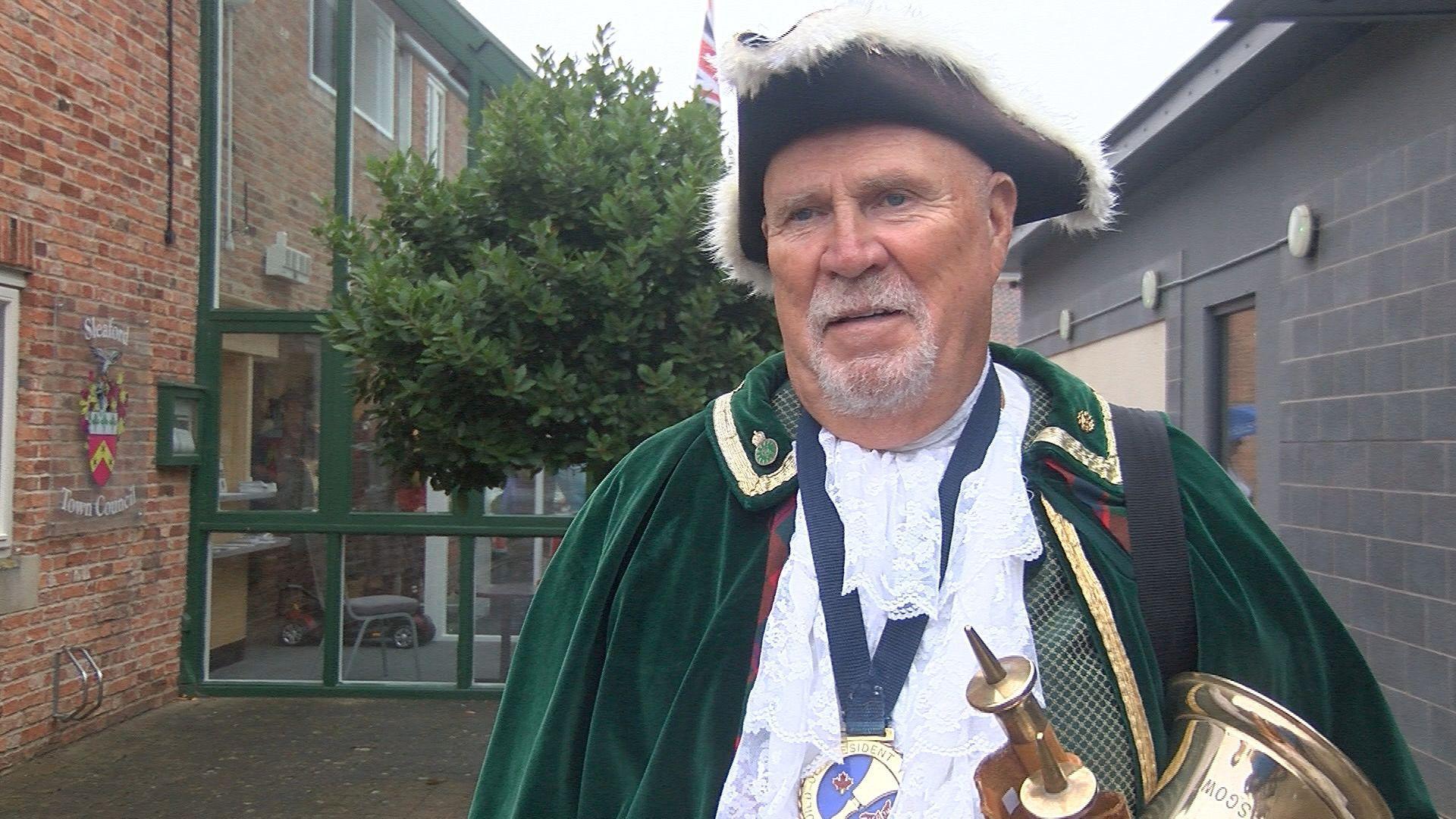 James Stewart, town crier for New Glasgow, Nova Scotia, in a green outfit