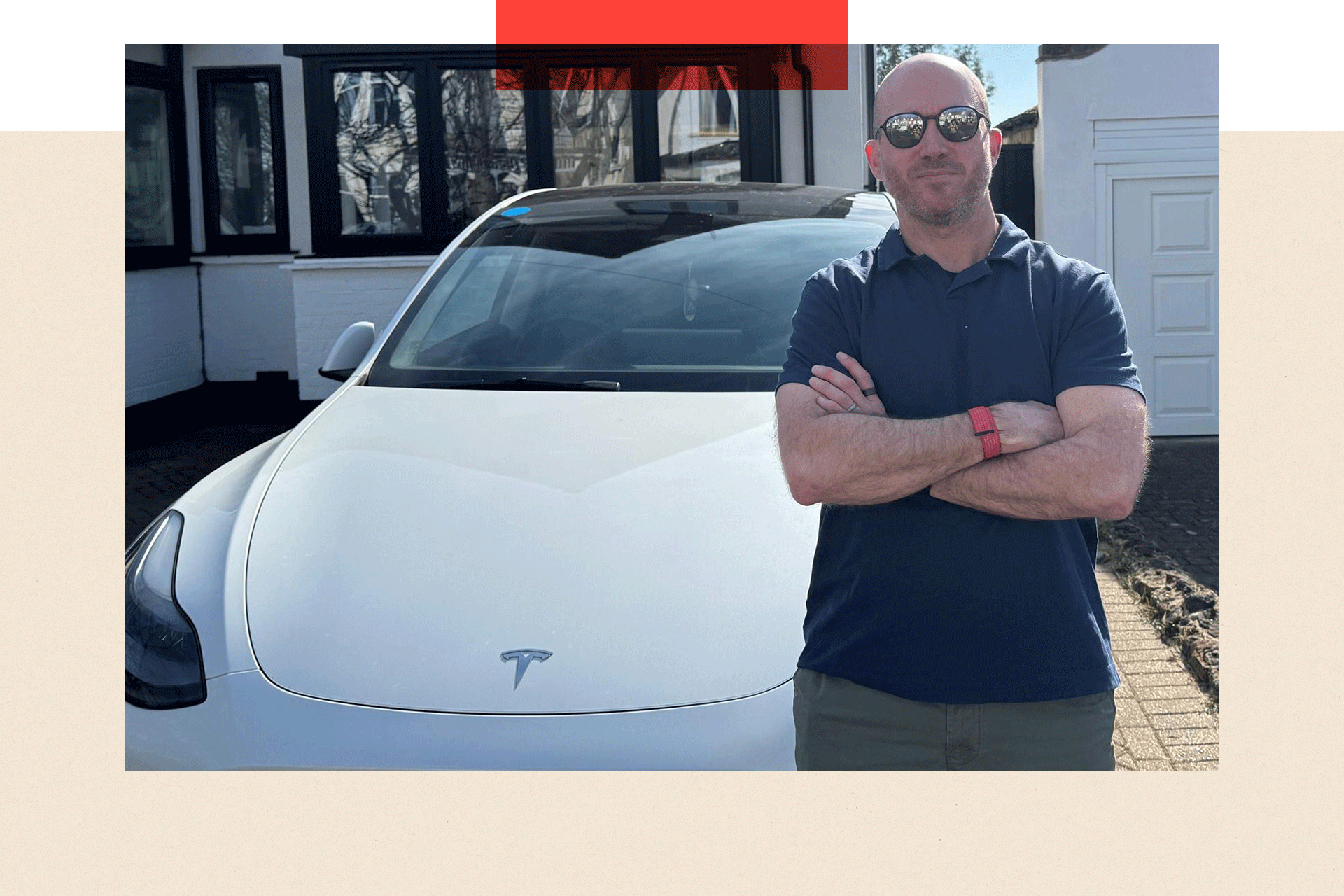 Ben Kilbey stands in front of his Tesla Model Y