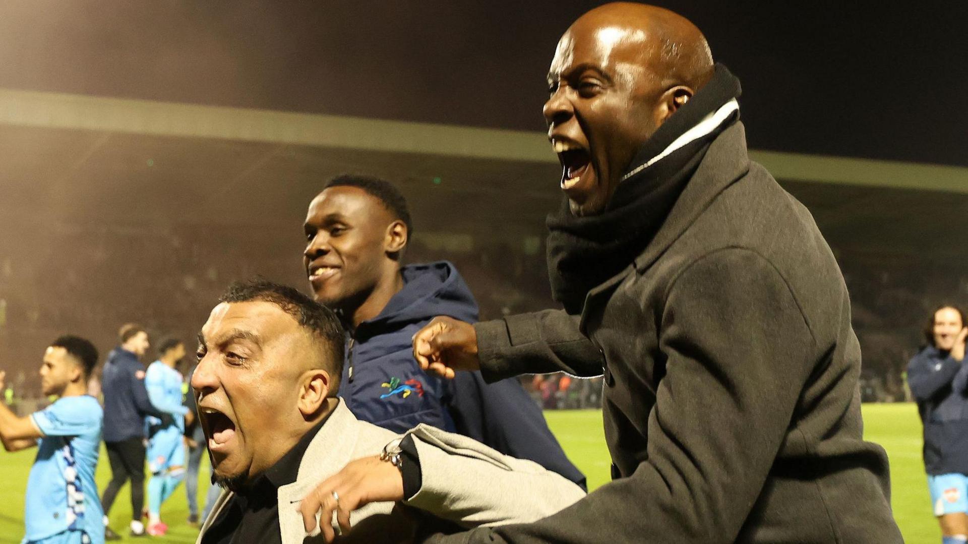 George Akhtar and Fabian Forde celebrate victory over Northampton in the first round of the FA Cup