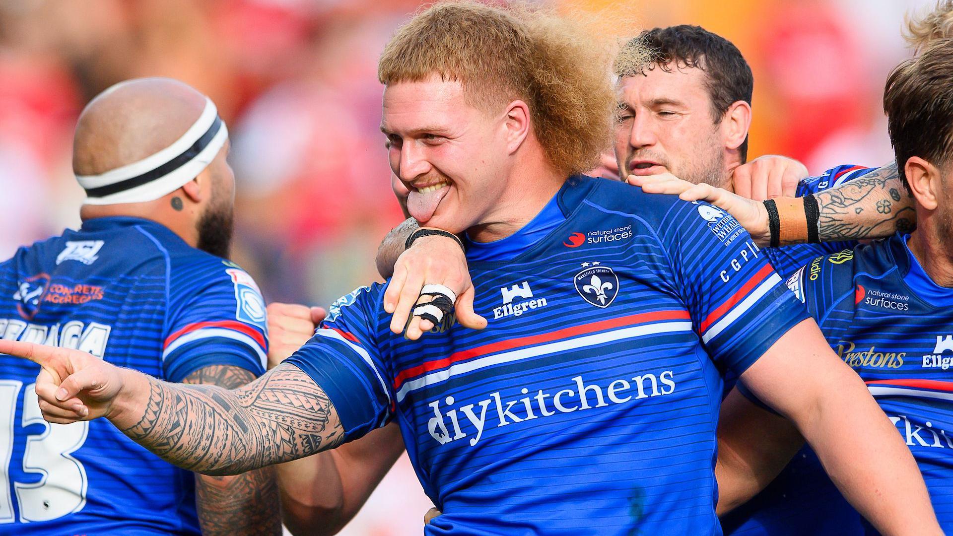 Caius Faatali celebrates scoring for Wakefield Trinity