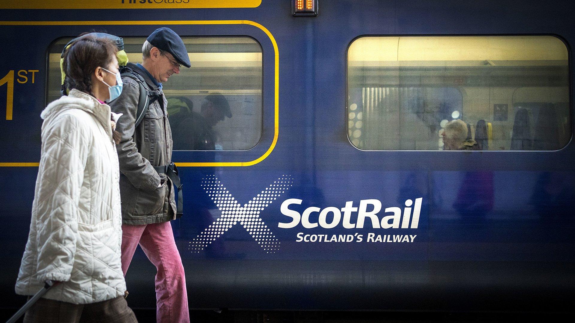 people beside train