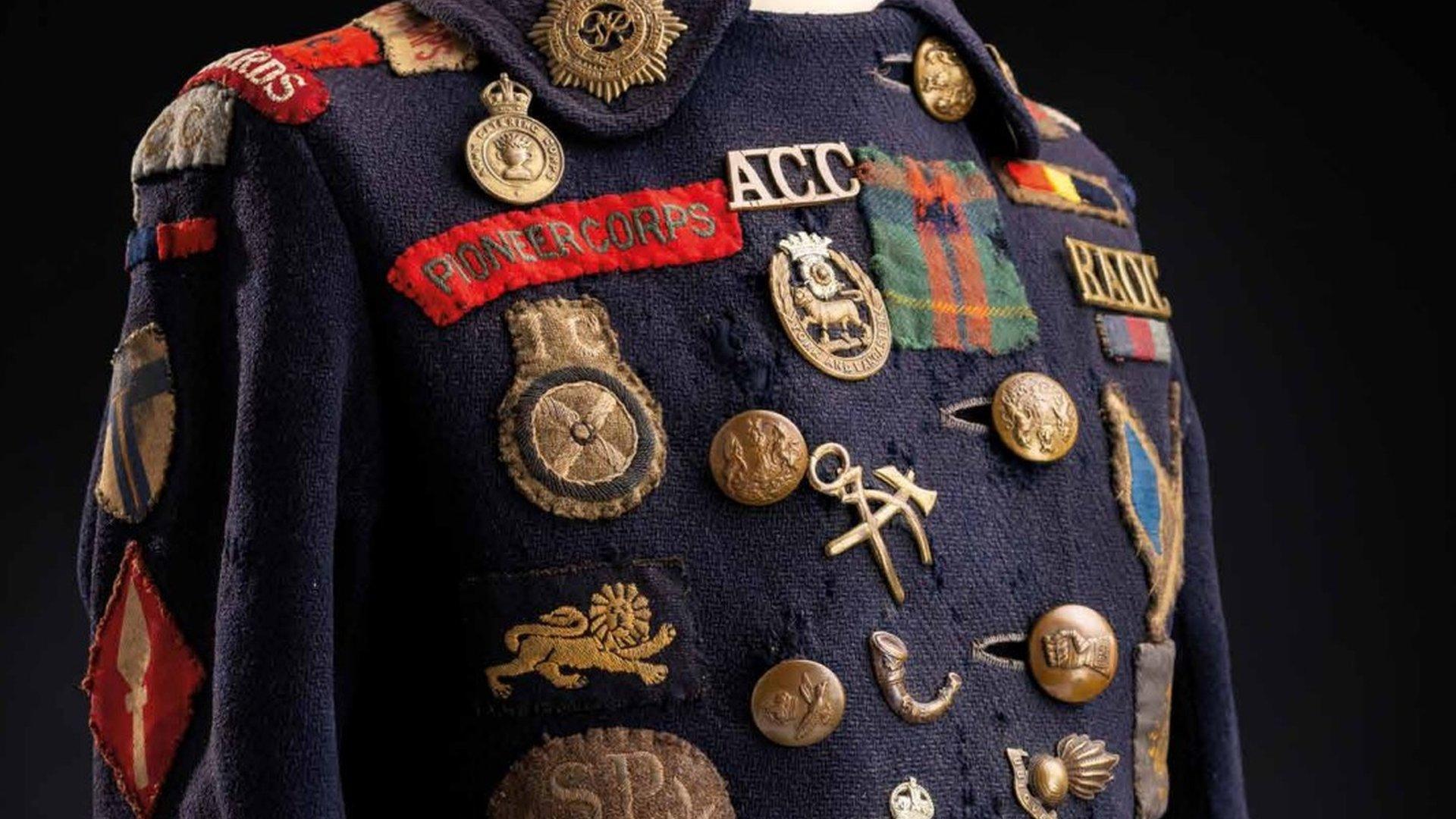 A coat covered in military badges