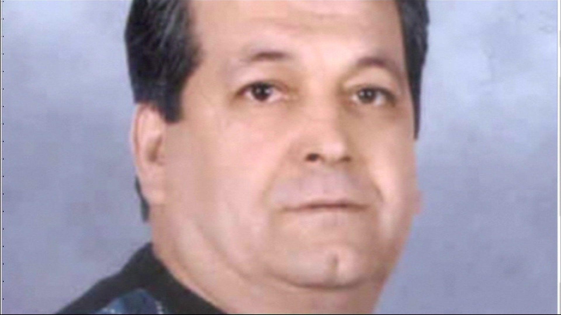 Ahmet Paytak has short dark hair and is wearing a dark top