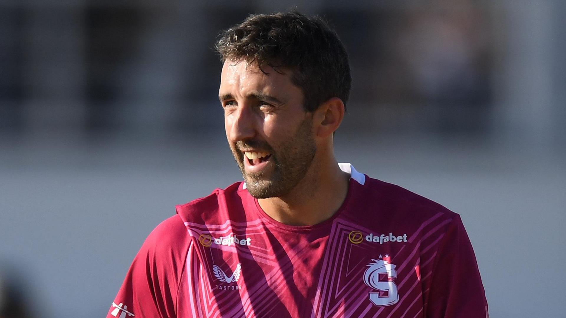 Ben Sanderson celebrates taking a wicket for Northants
