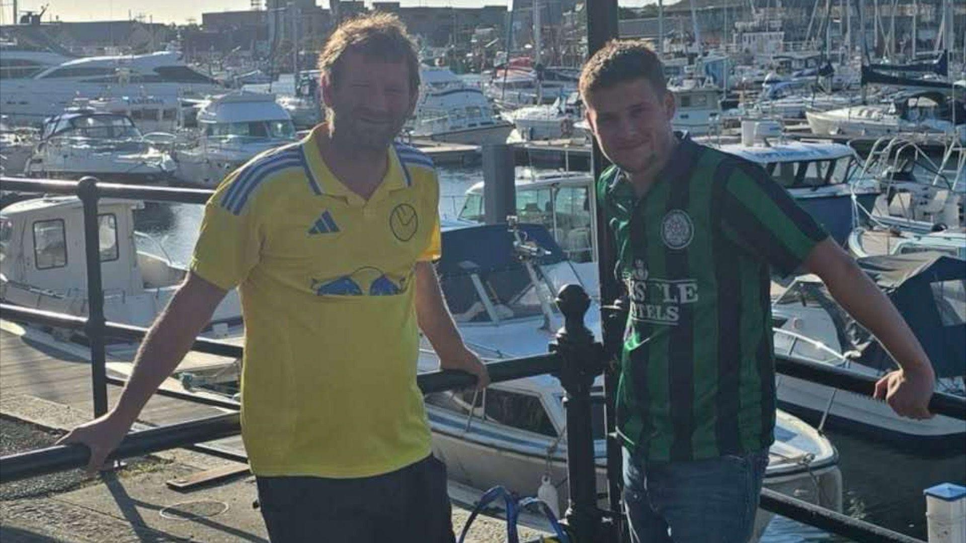 Carl O'Brien and Ed O'Brien pictured with a backdrop of boats