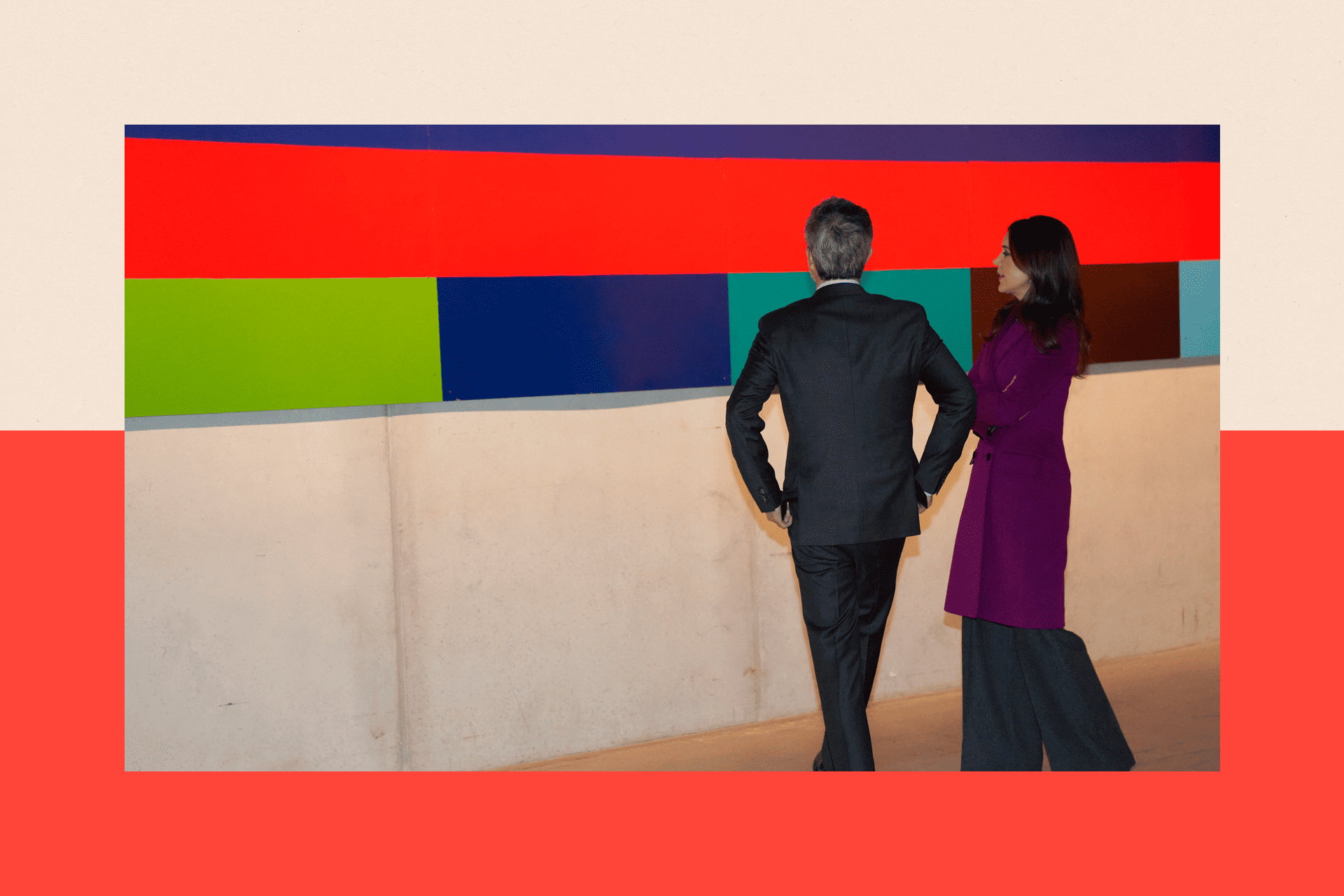 King Frederik X of Denmark and Queen Mary of Denmark look at a brightly colour art work 