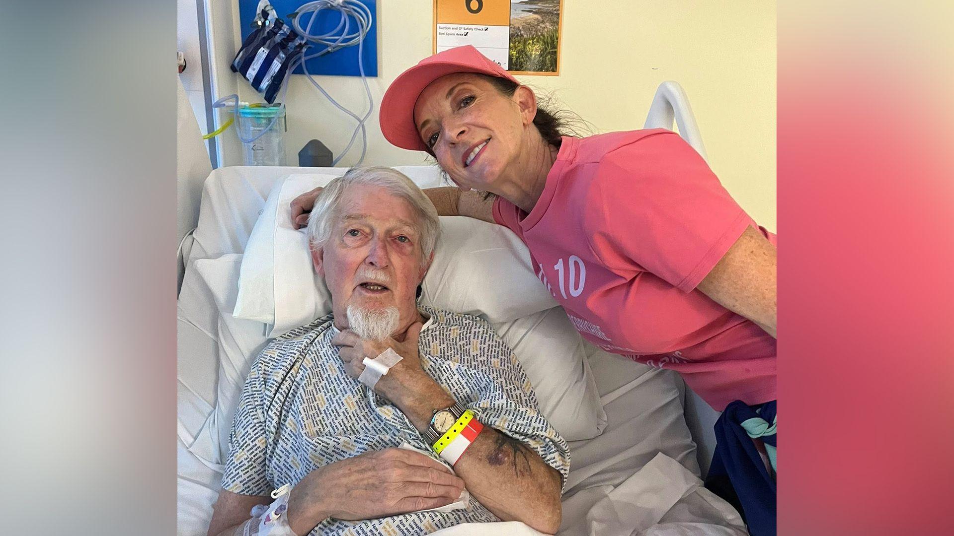 Sarah-Jane Hill sitting next to her dad in a hospital bed