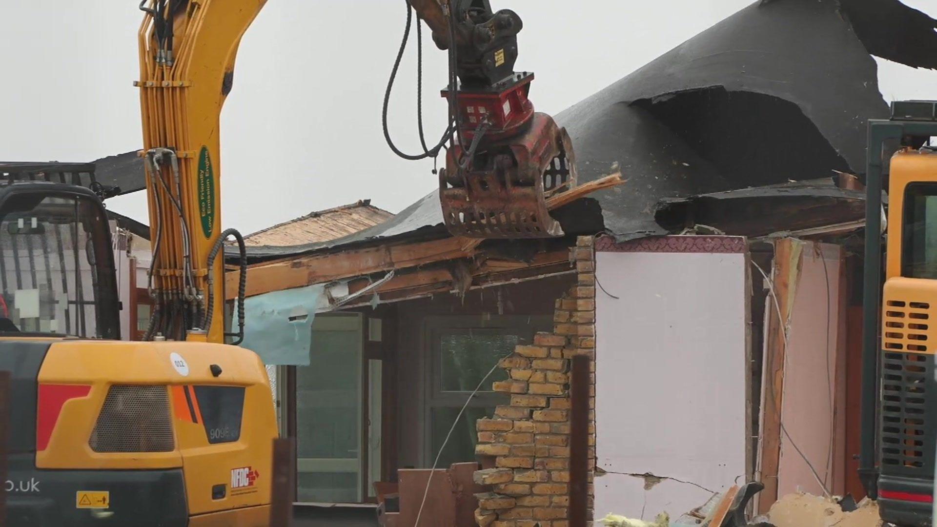 JCB takes down a chalet