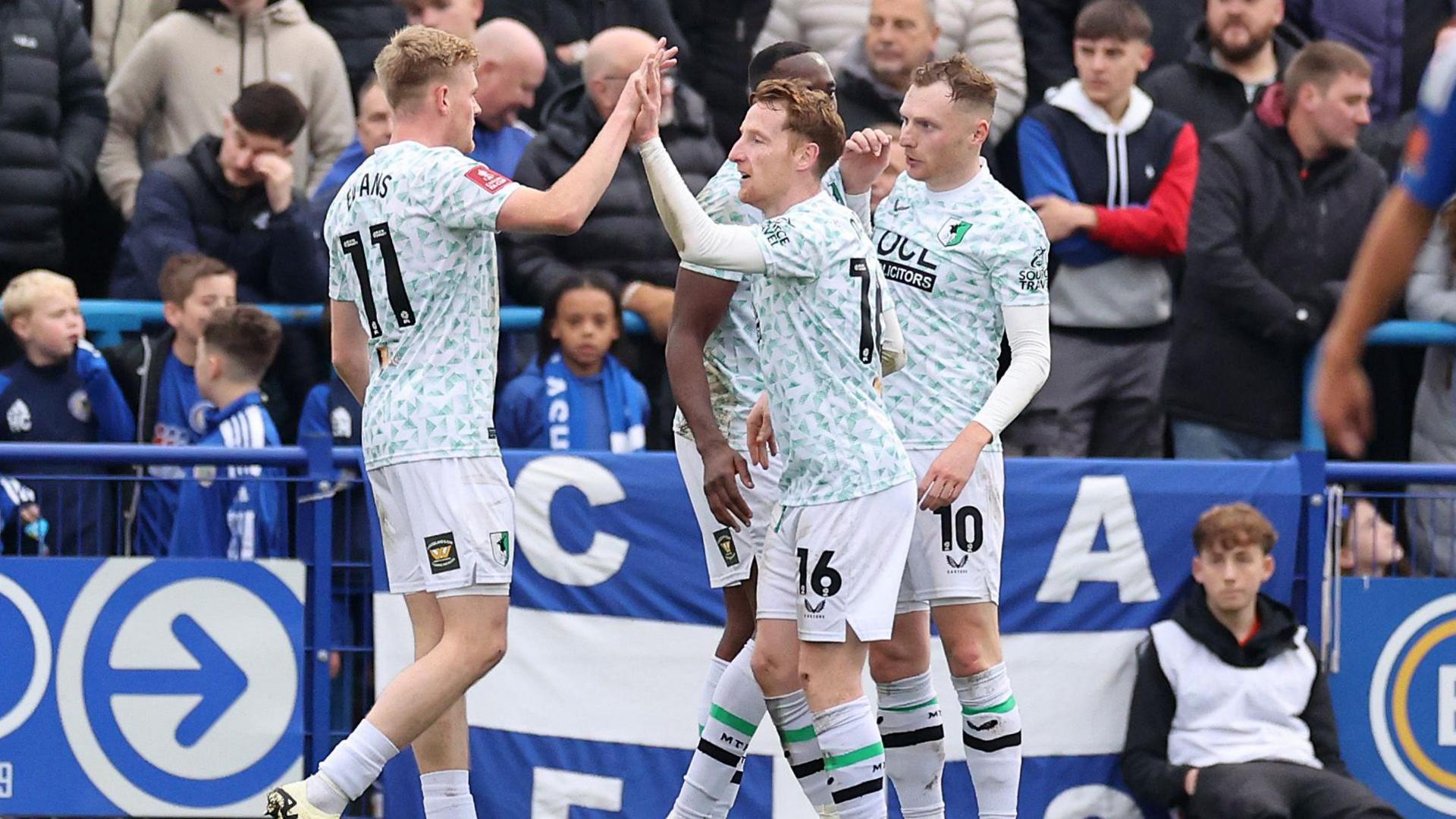 Mansfield Town celebrate scoring against Curzon Ashton