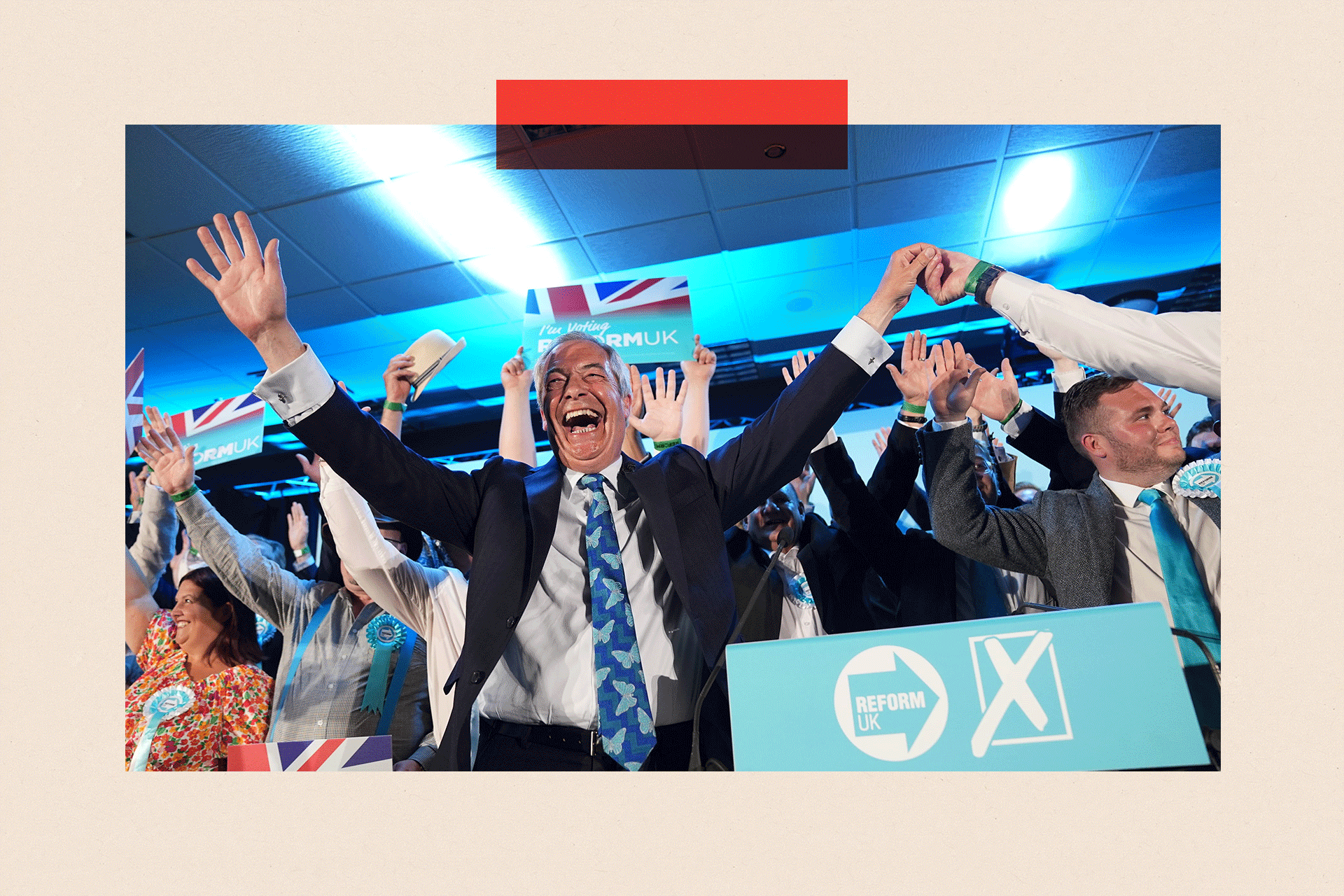 Reform UK party leader Nigel Farage with his party's candidates onstage during a campaign event at Stafford Showground