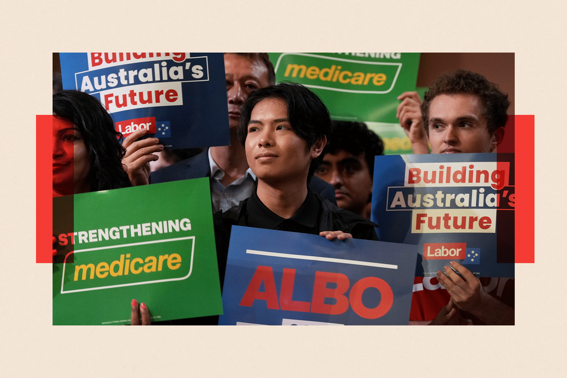 Labor Party supporters hold placards during a Labor Party rally at Parramatta Town Hall