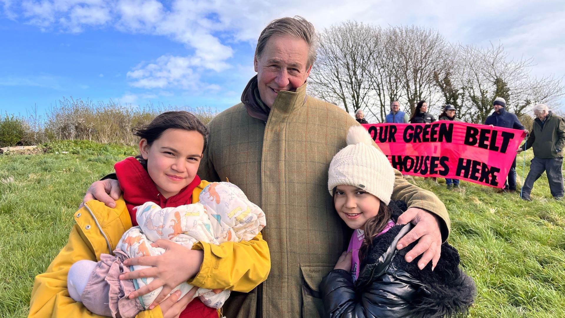 Farmer Gerald Addicott and his granddaughters