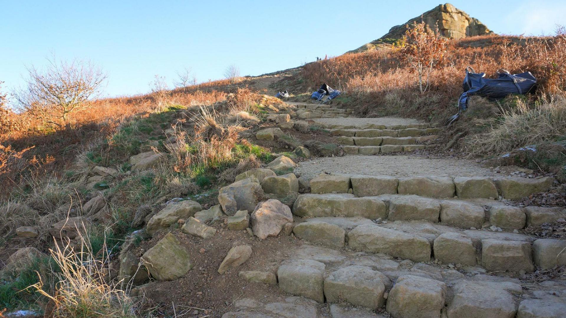 The stone steps now cover the whole of the path and the eroded sides have gone.