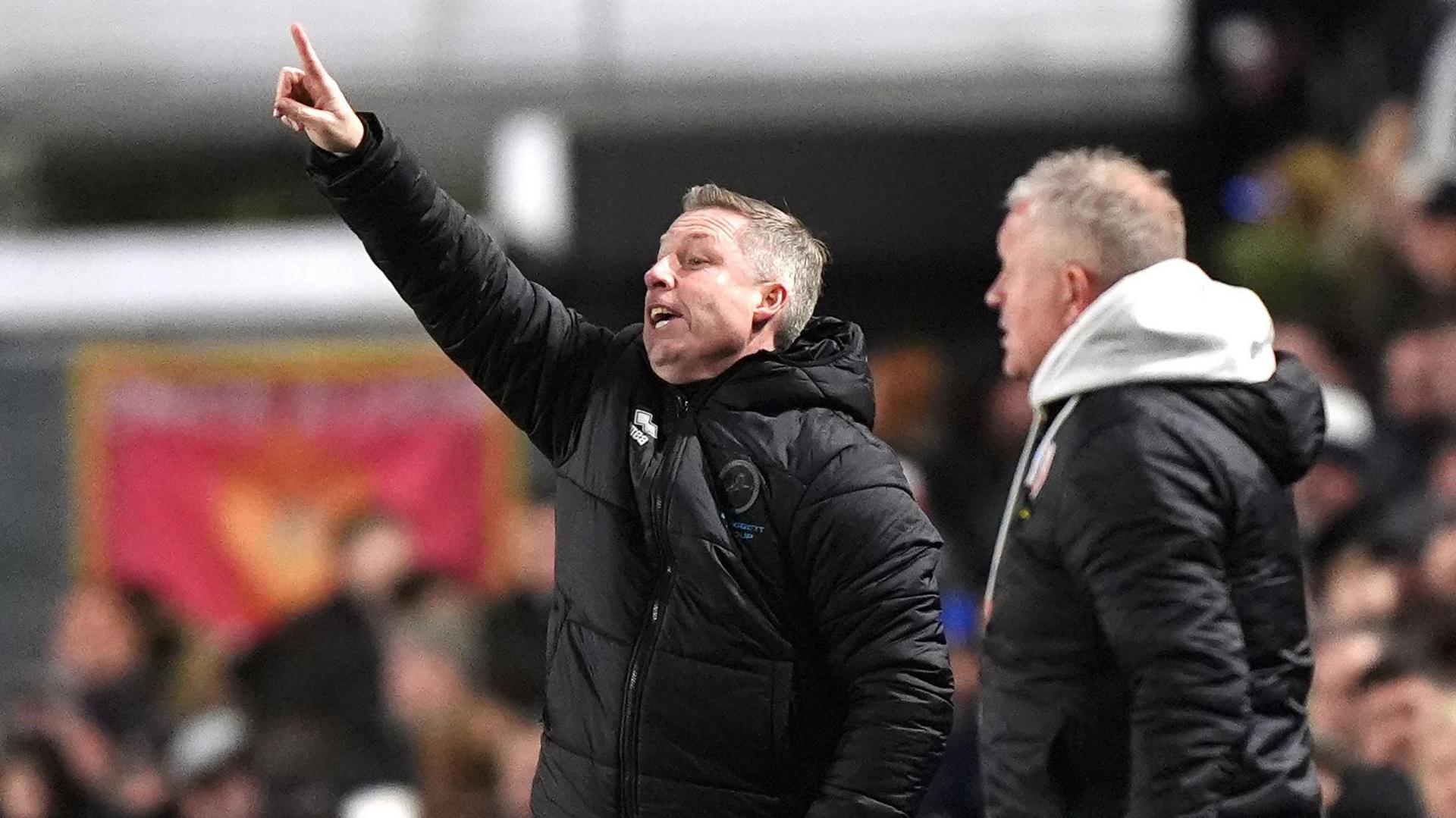 Neil Harris and Chris Wilder on the touchline