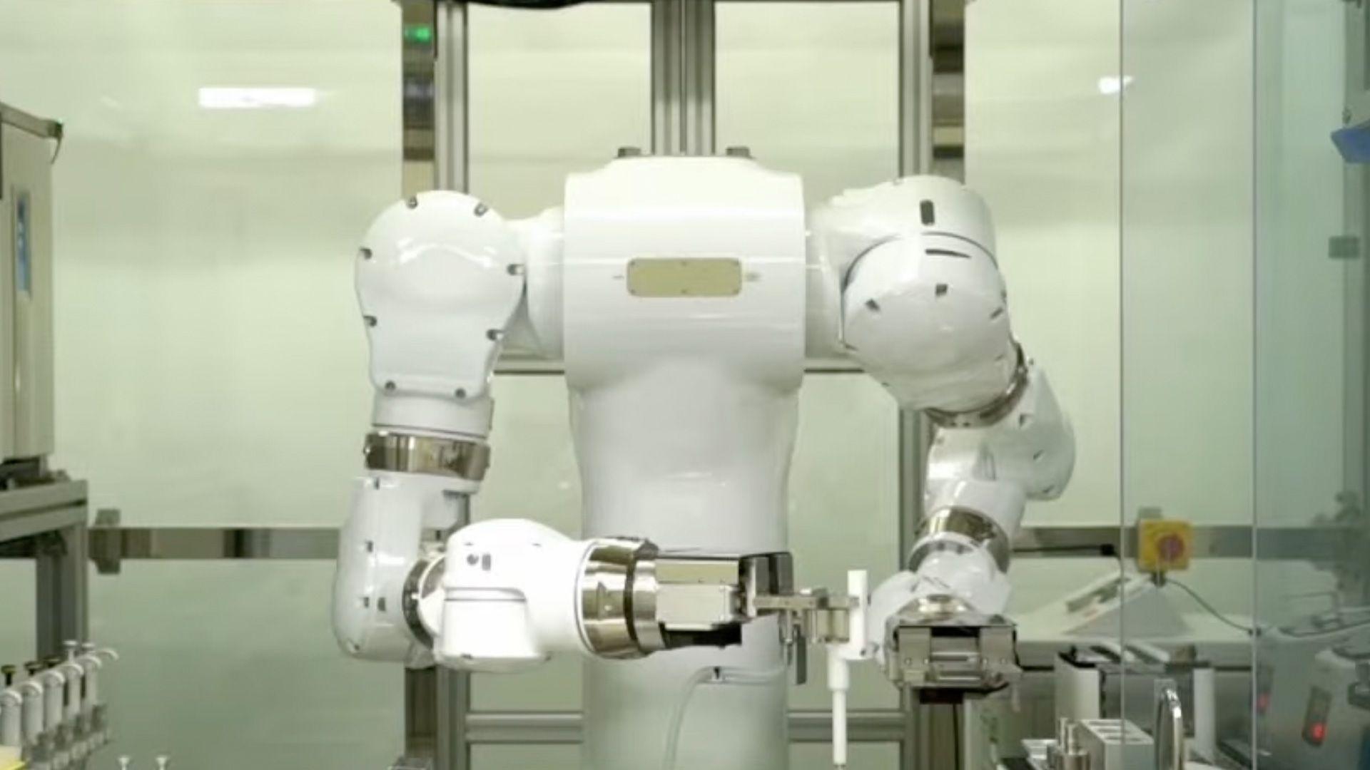 A big white robot with arms in a science lab