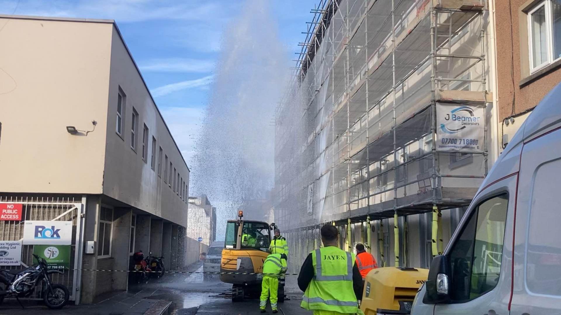 Jersey Water engineers at a burst water main