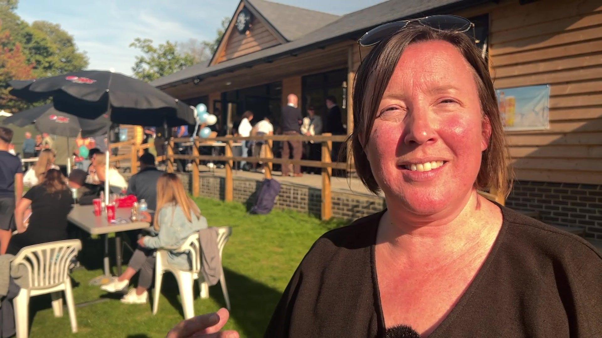 Nicky Lamb stood outside the new pavilion and staring towards the camera