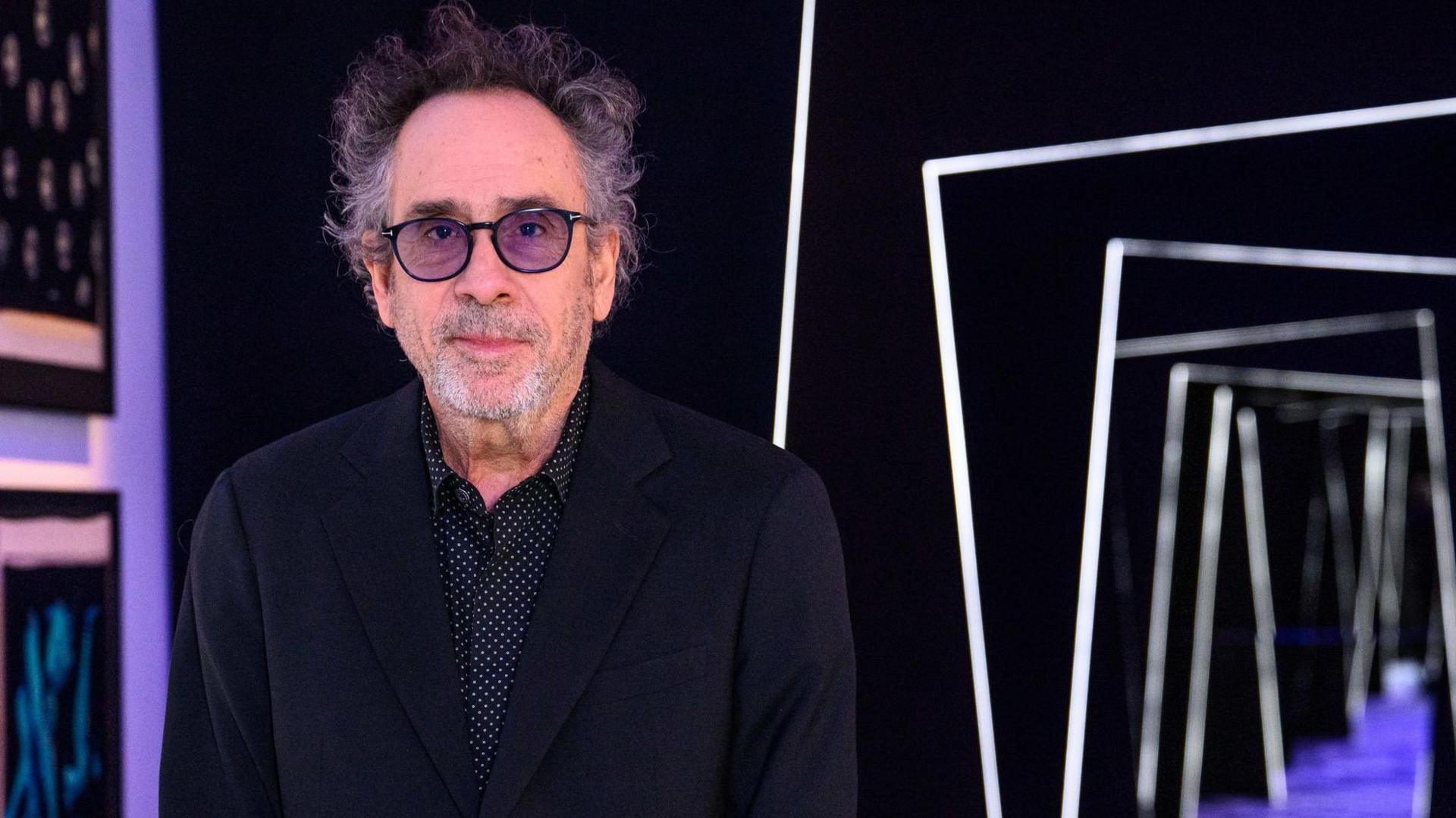 Tim Burton visits the new exhibition dedicated to his career at the Design Museum in London ahead of it opening to the public on Friday. 