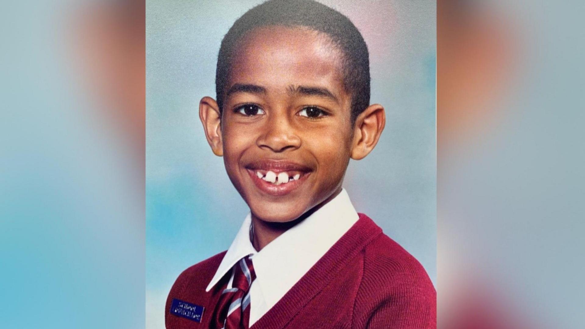 Image of Eastbourne MP Josh Babarinde as a child in a school photo