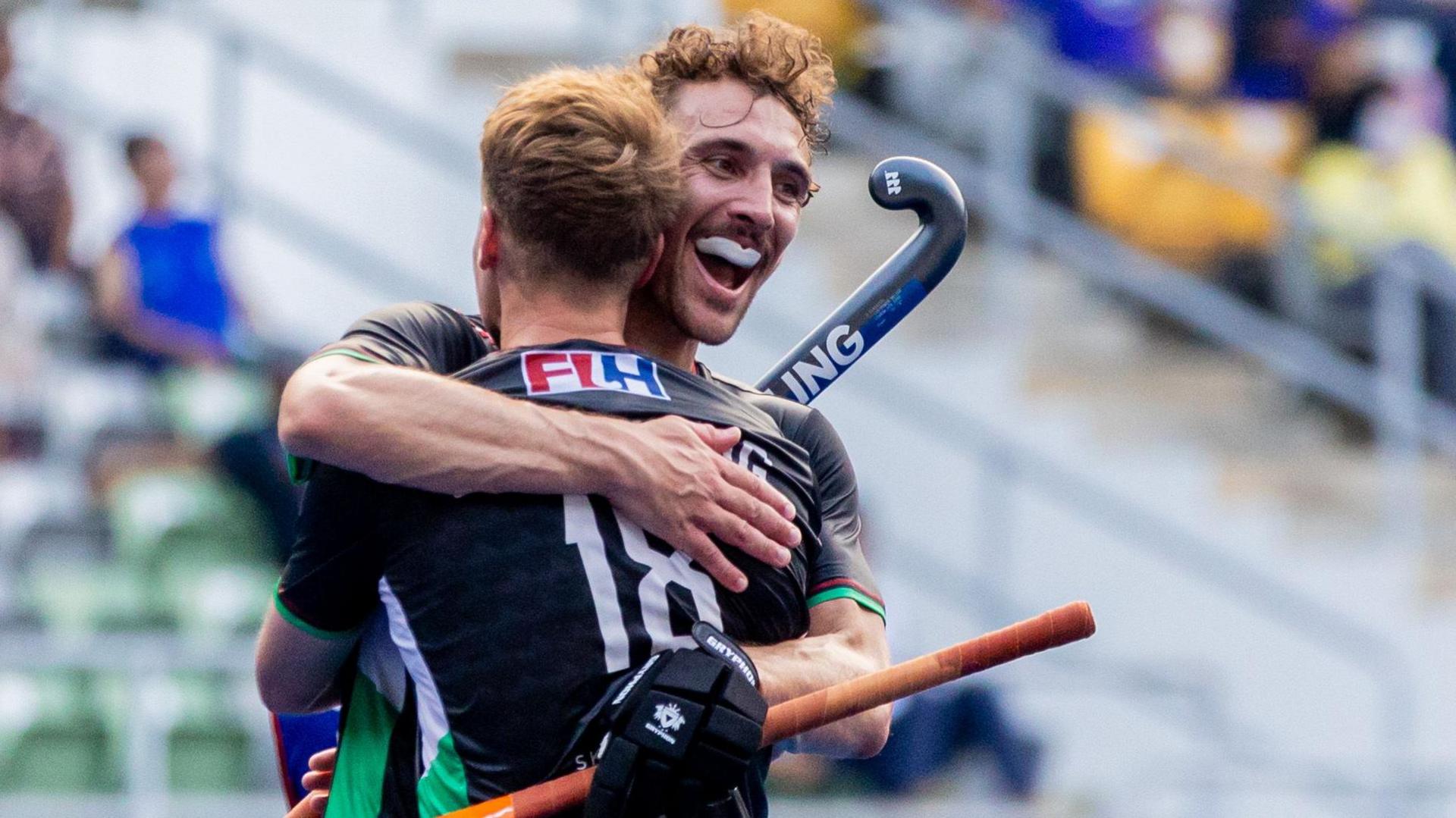 Daniel Kyriakides is hugged by a teammate