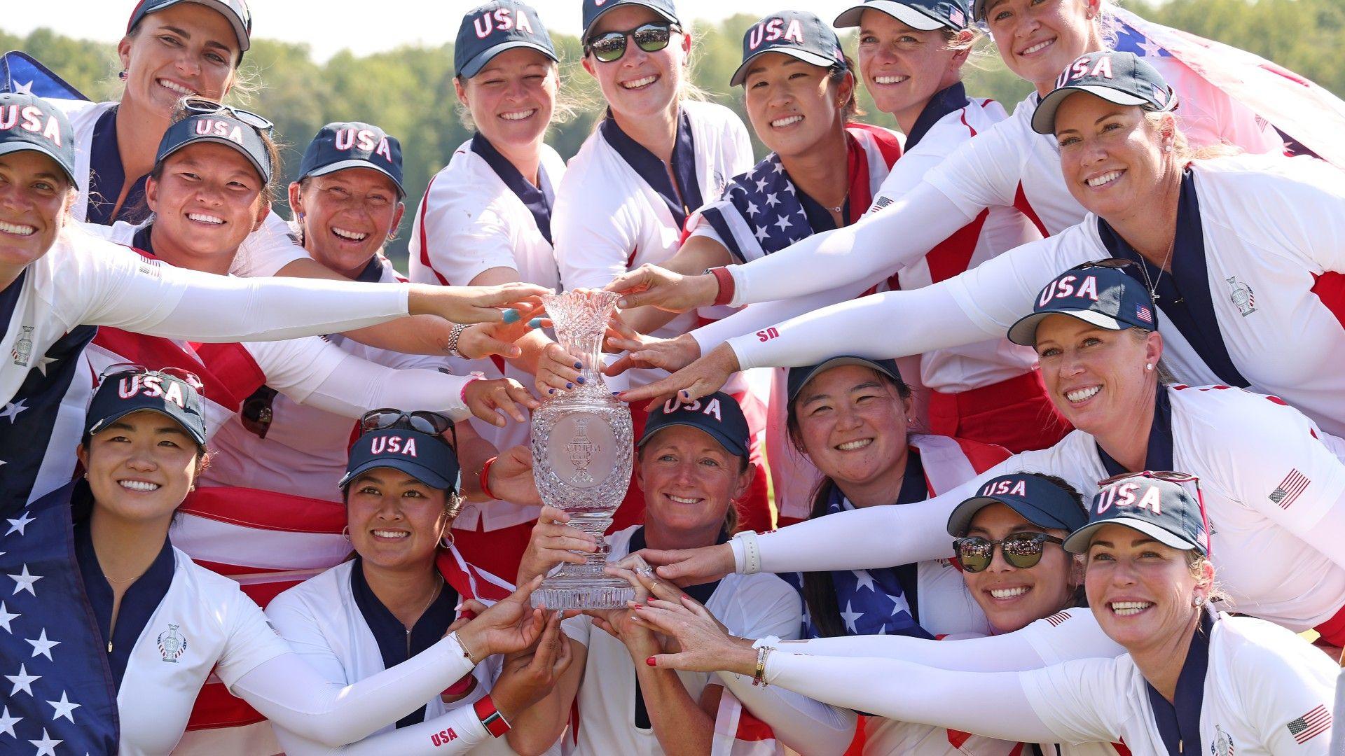 The winning members of the US Solheim Cup team with the trophy