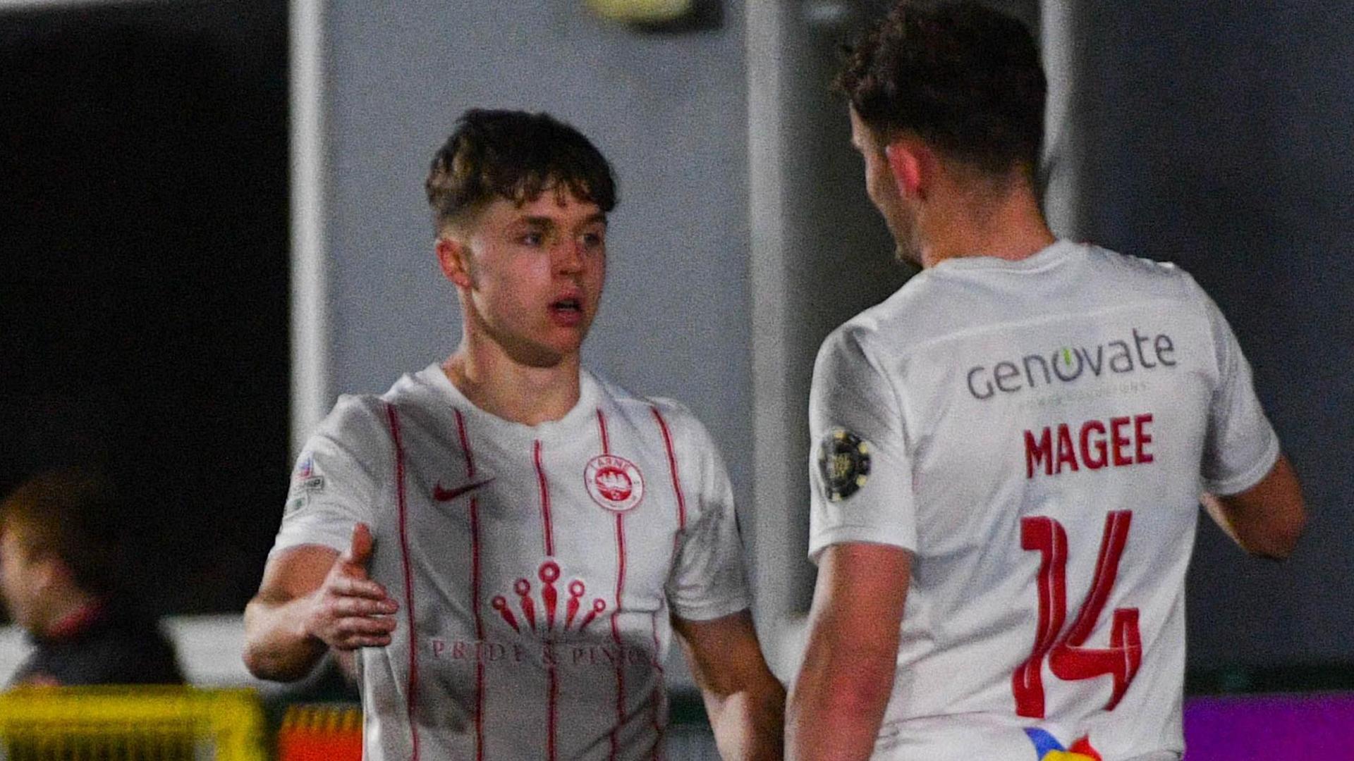 Larne's hat-trick hero Matty Lusty is congratulated by Benji Magee