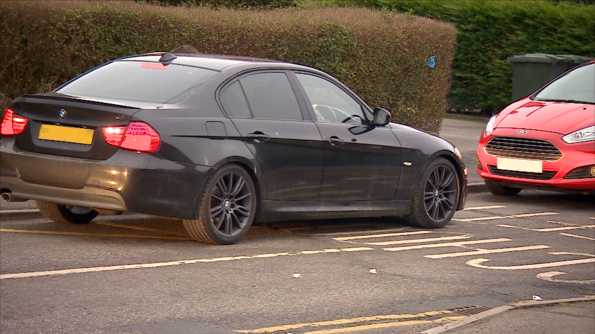 car parked on yellow zigzag lines