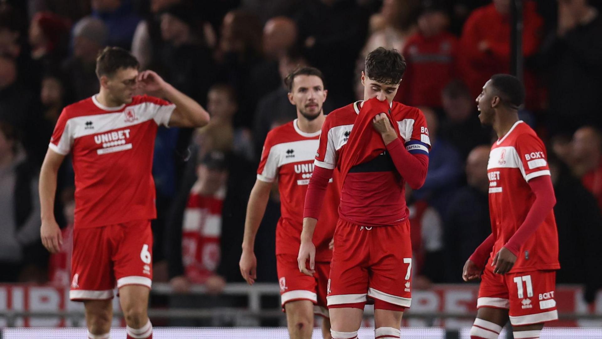 Captain Hayden Hackney leads a group of disconsolate Middlesbrough players after they let slip a 3-0 lead.  