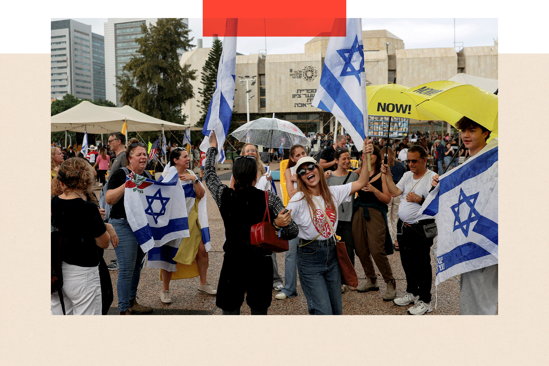 People celebrate holding Israeli flags