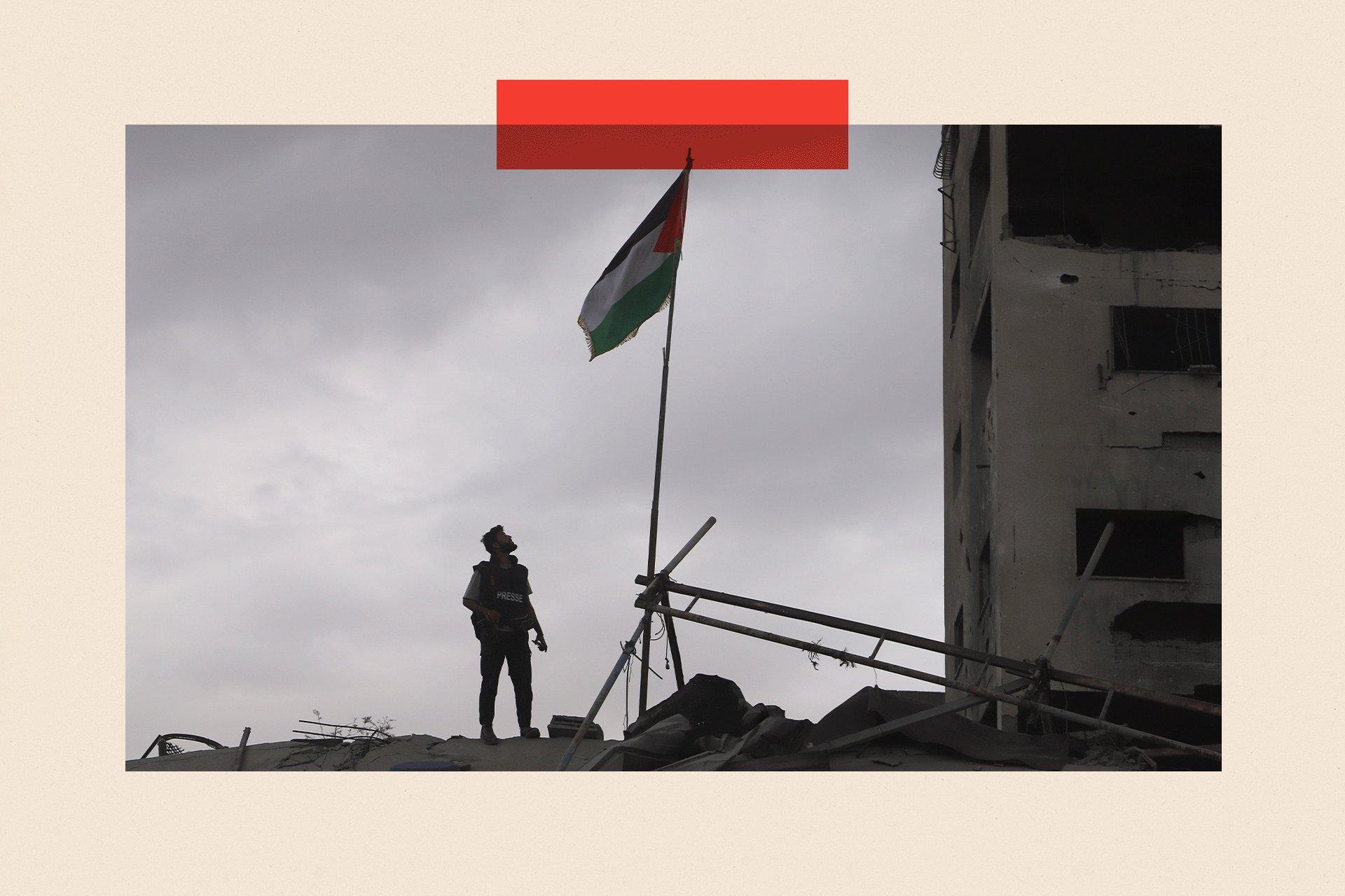 A press member looks at the Palestinian flag
