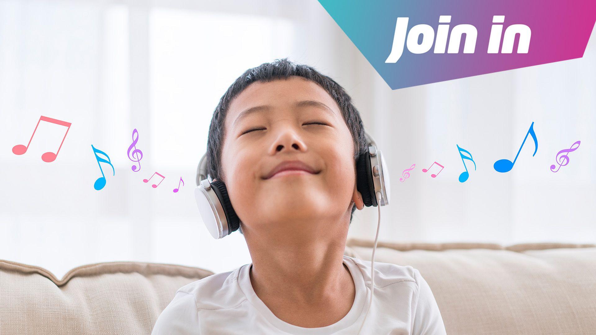 Boy holding his head up wearing headphones and music notes coming out of his ears. In the corner it says: "join in"