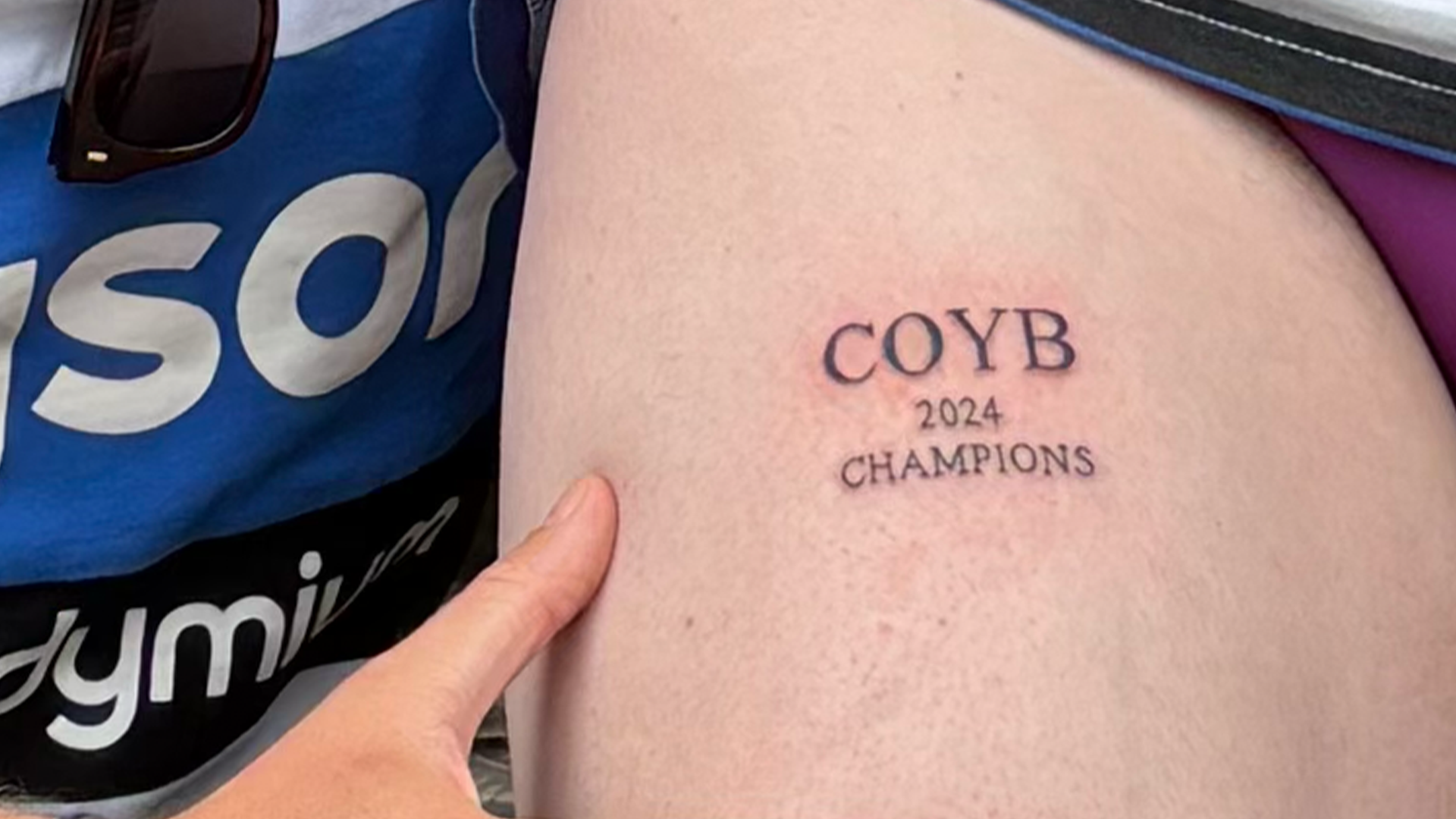 Close up of Ben Craven's COYB Champions 2024 tattoo on his thigh